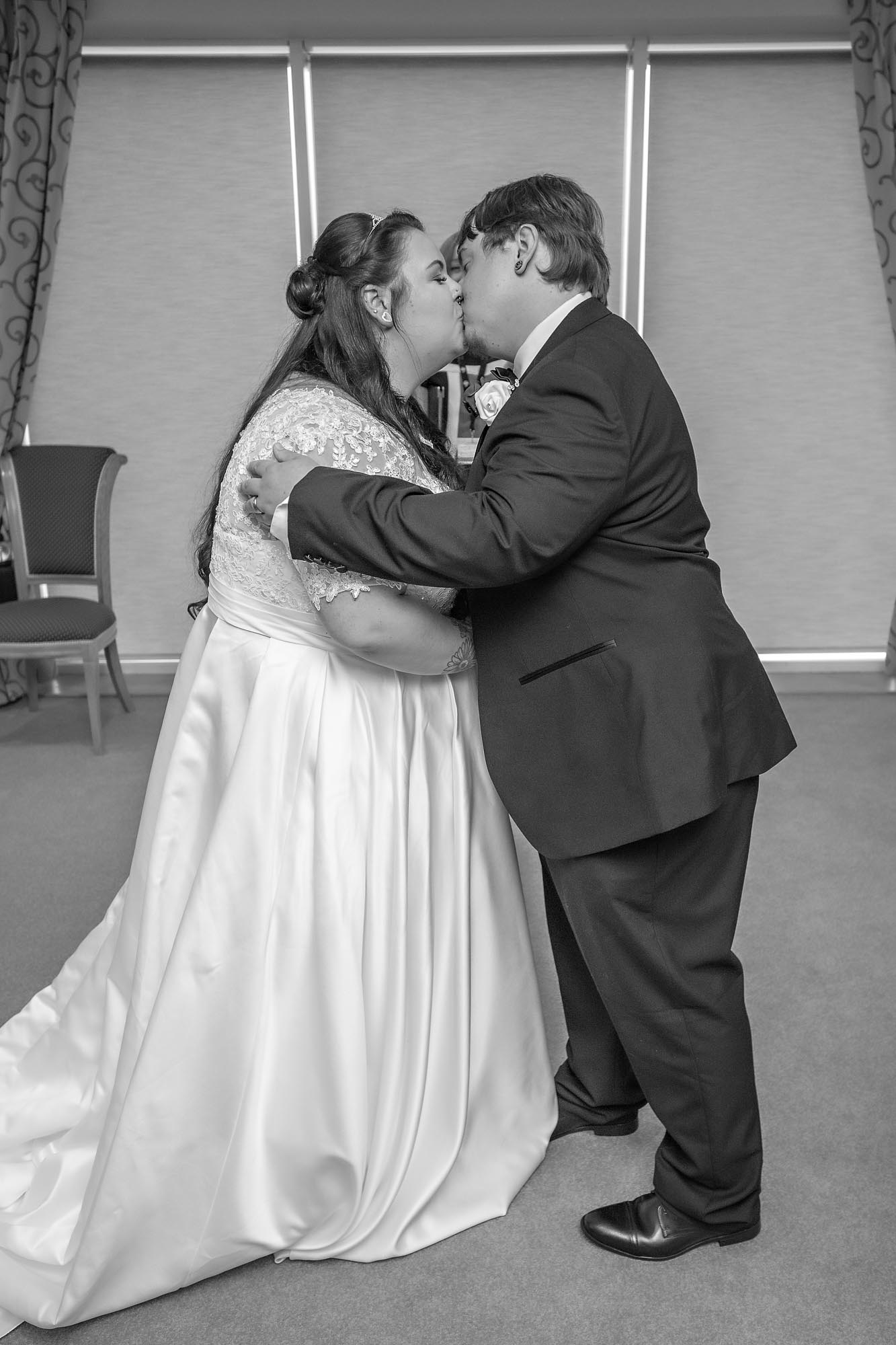 The Bride and Groom have their first kiss in Caerphilly Register Office - Penallta House