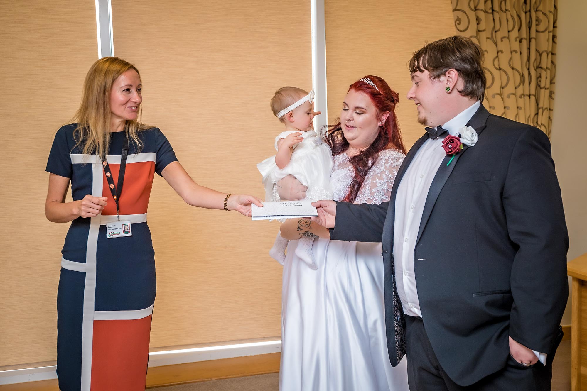 The registrar hands the Bride and Groom their wedding certificate at Penallta House