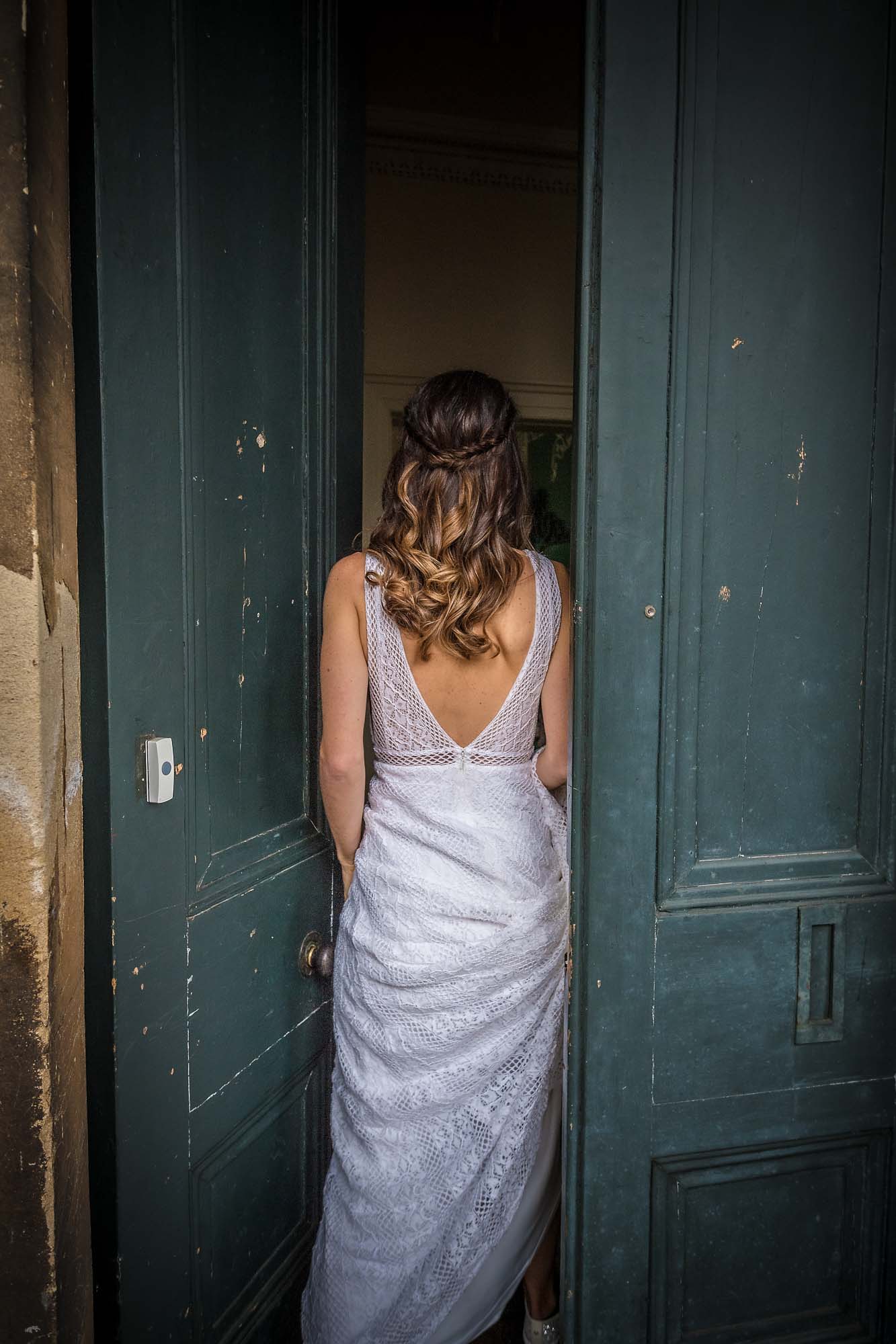 Bride entering West Lodge, Arnos Vale from back