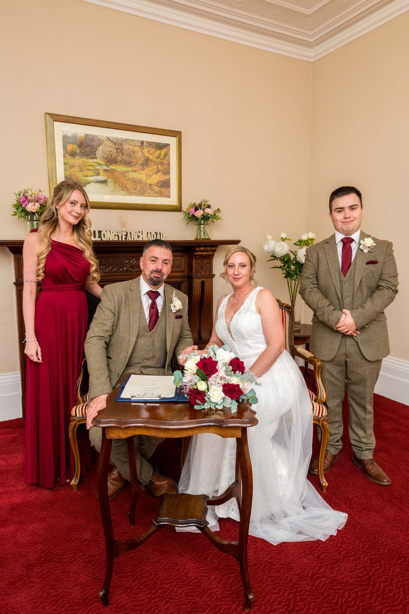 The newlyweds and their witnesses pose after their register signing in Newport