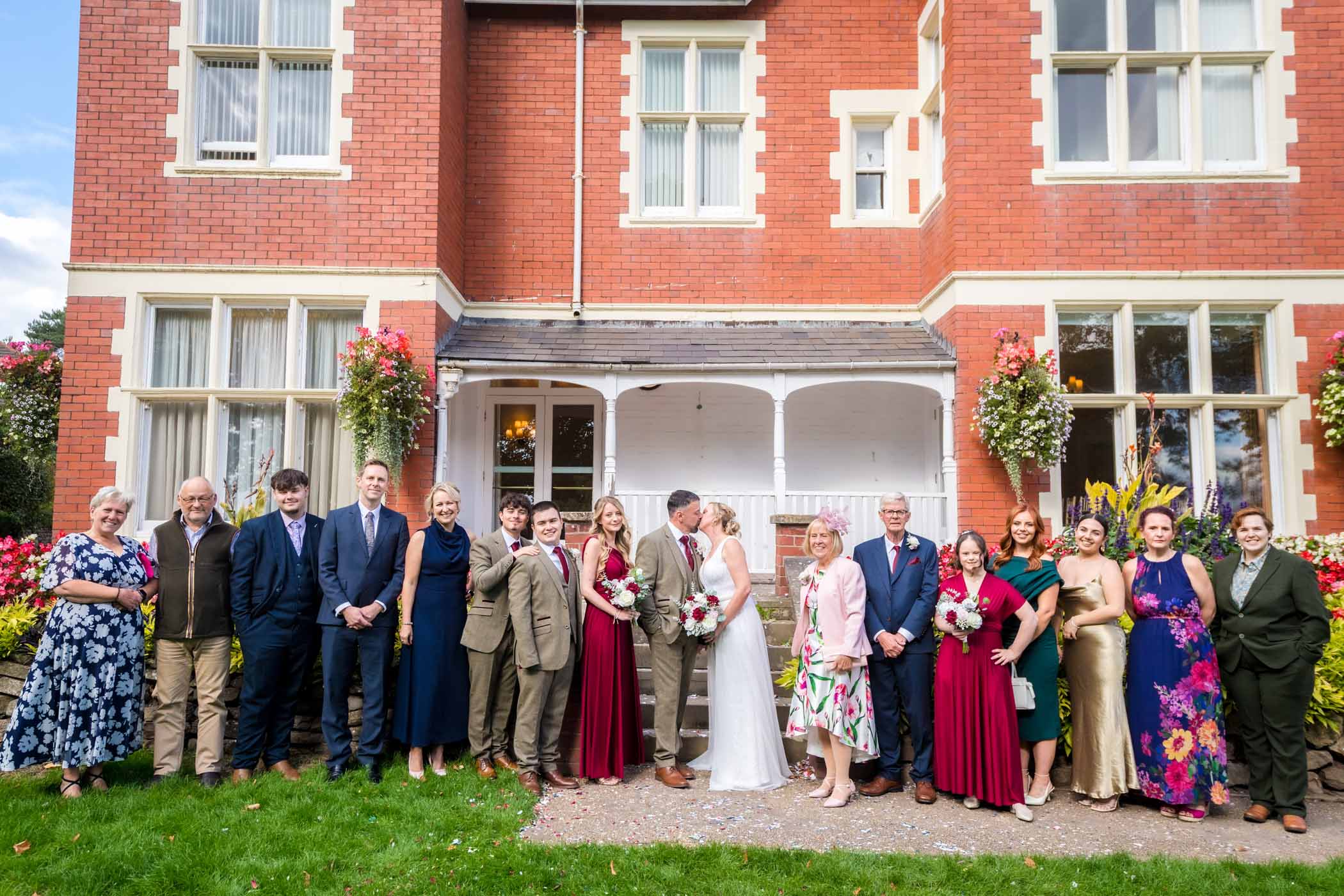 Guests line up with the couple in front of Newport Register Office/Mansion house