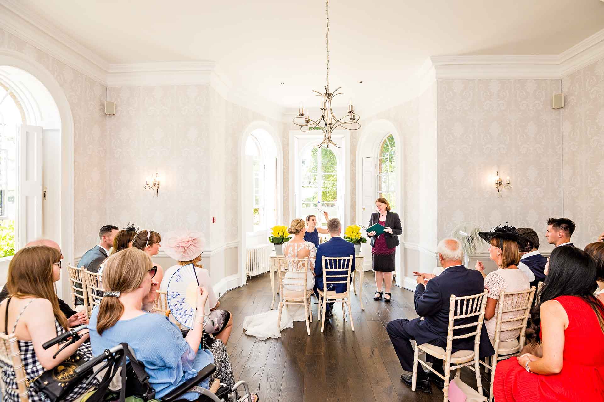 Couple Just Married at Merton Park House Sheridan Room Wedding from Back - Morden Park House