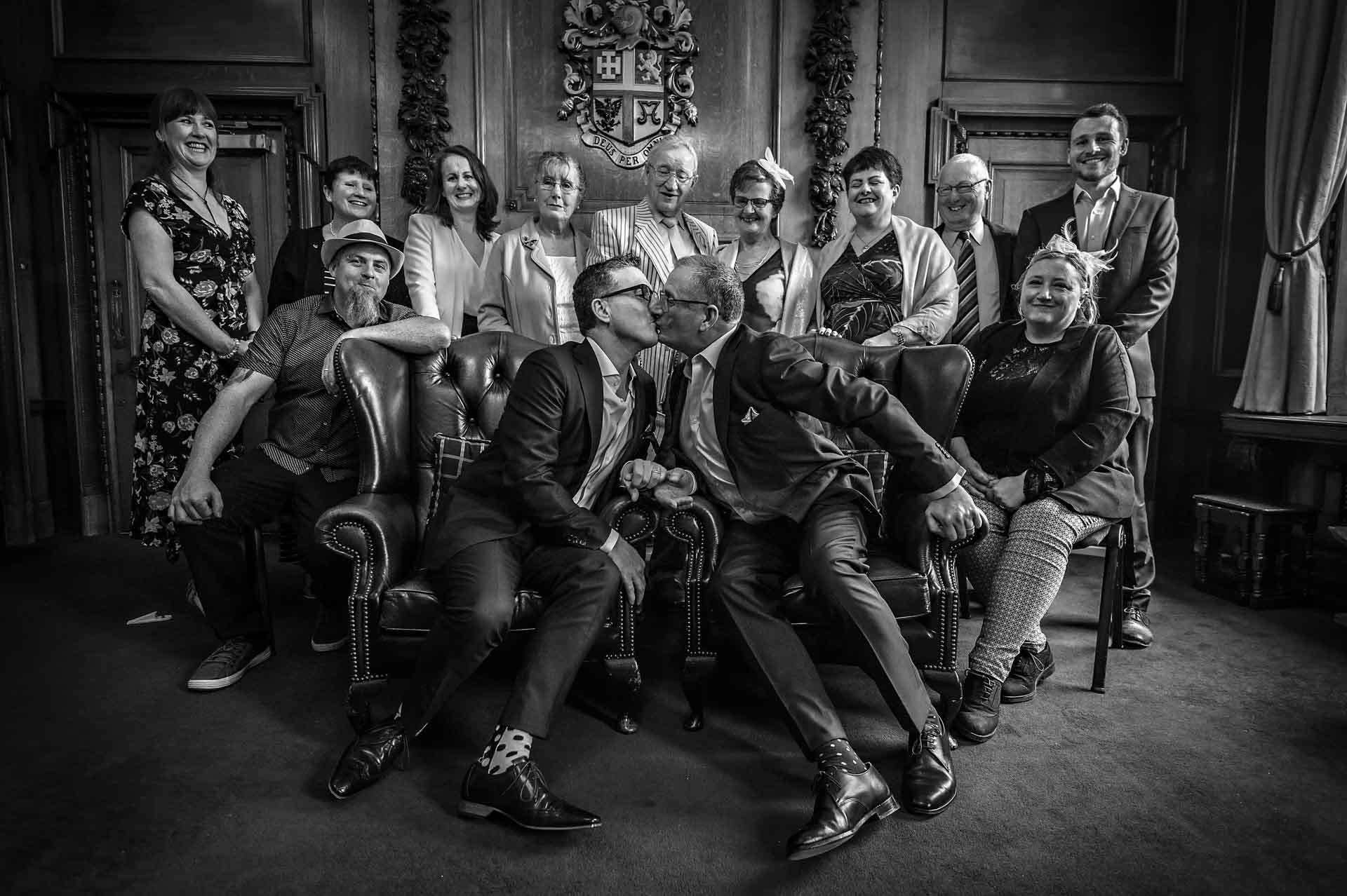 Group Shot in Mayor's Parlour at Islington at LGBT Wedding - Couple Kissing