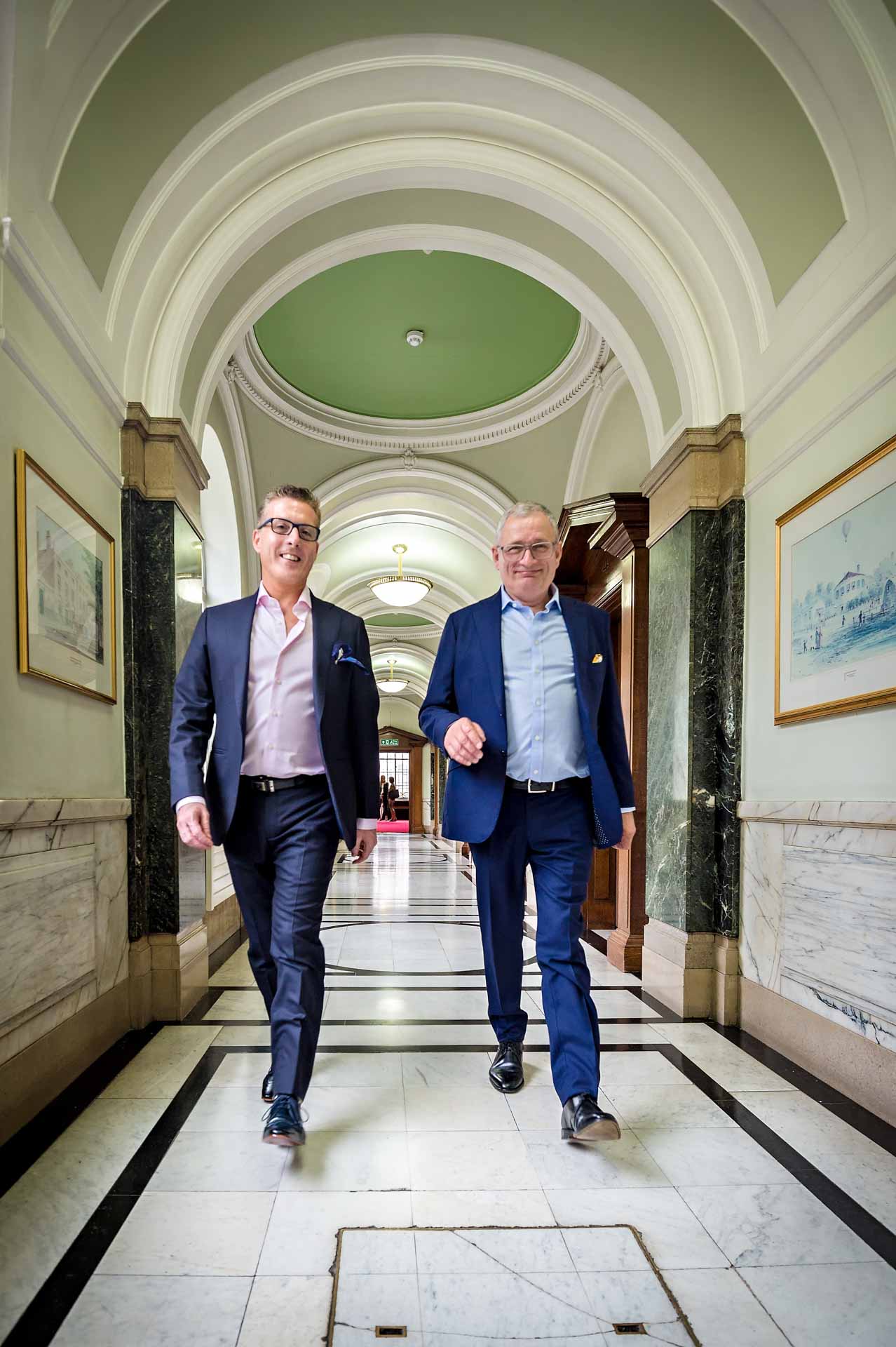 Same-sex Couple Walking Down Corridor at Wedding