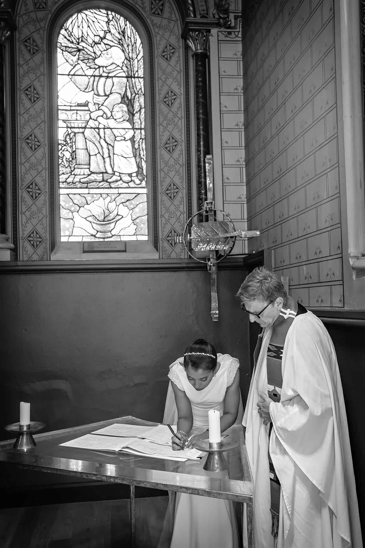 Bride signing the register at King's College London