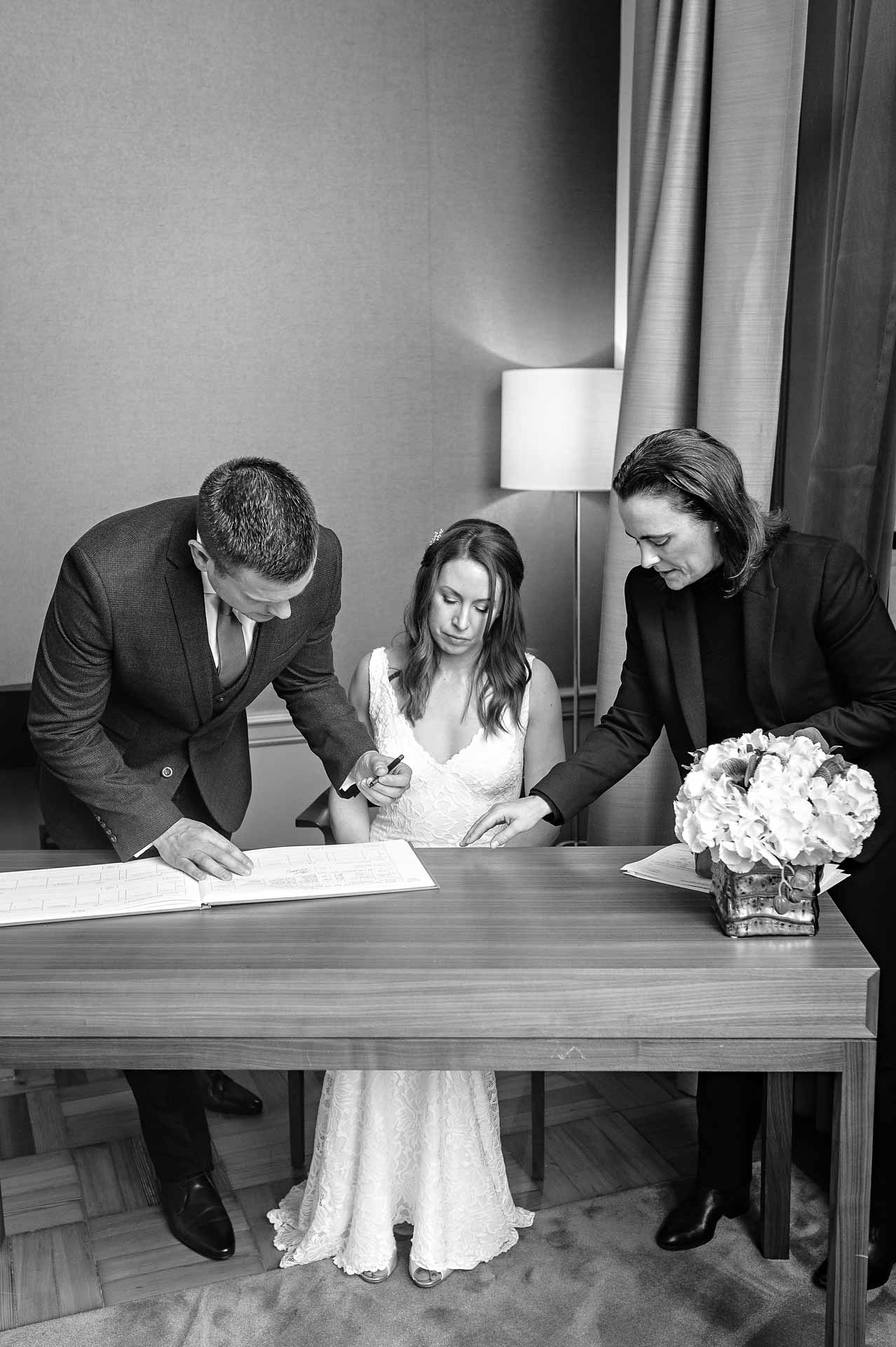 Couple signing register at Old Marylebone Town Hall