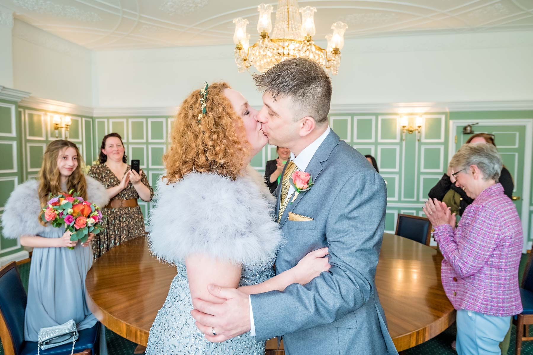First kiss at small wedding in the Chairman's Room of Bromley Civic Centre