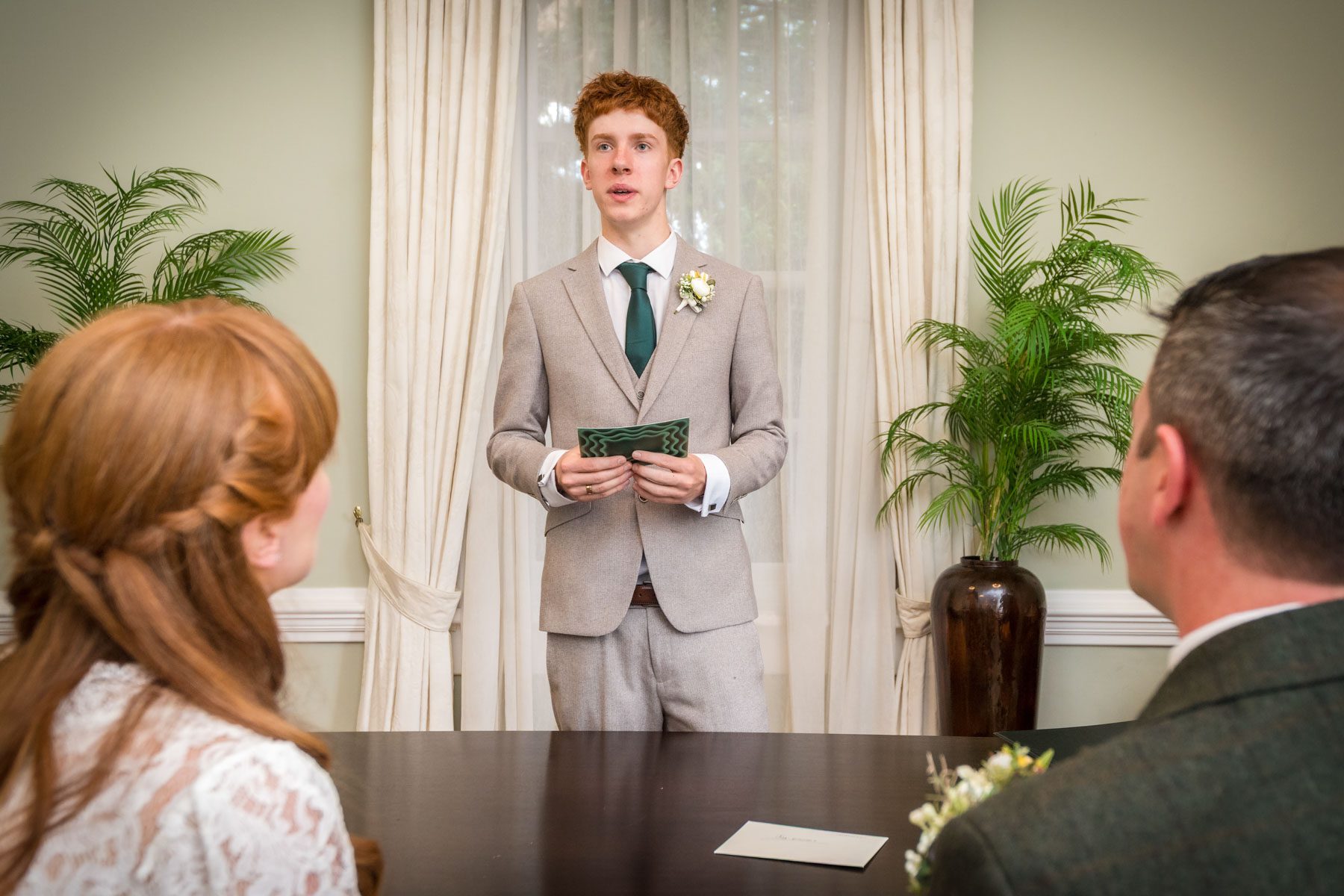 Young guest reads at wedding in York House