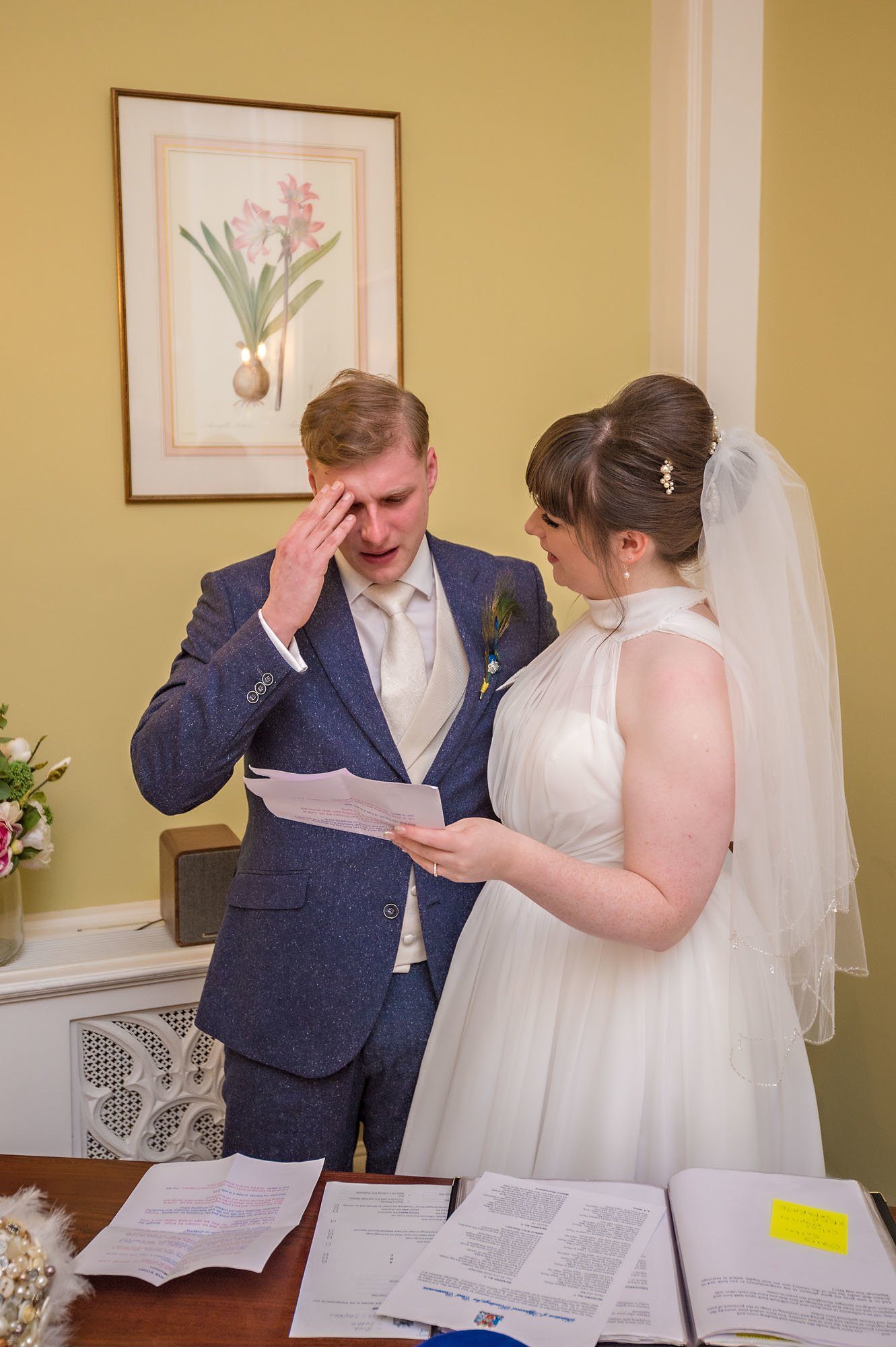 The groom is upset as he is reading a poem at his ceremony in Chelsea as his bride watches