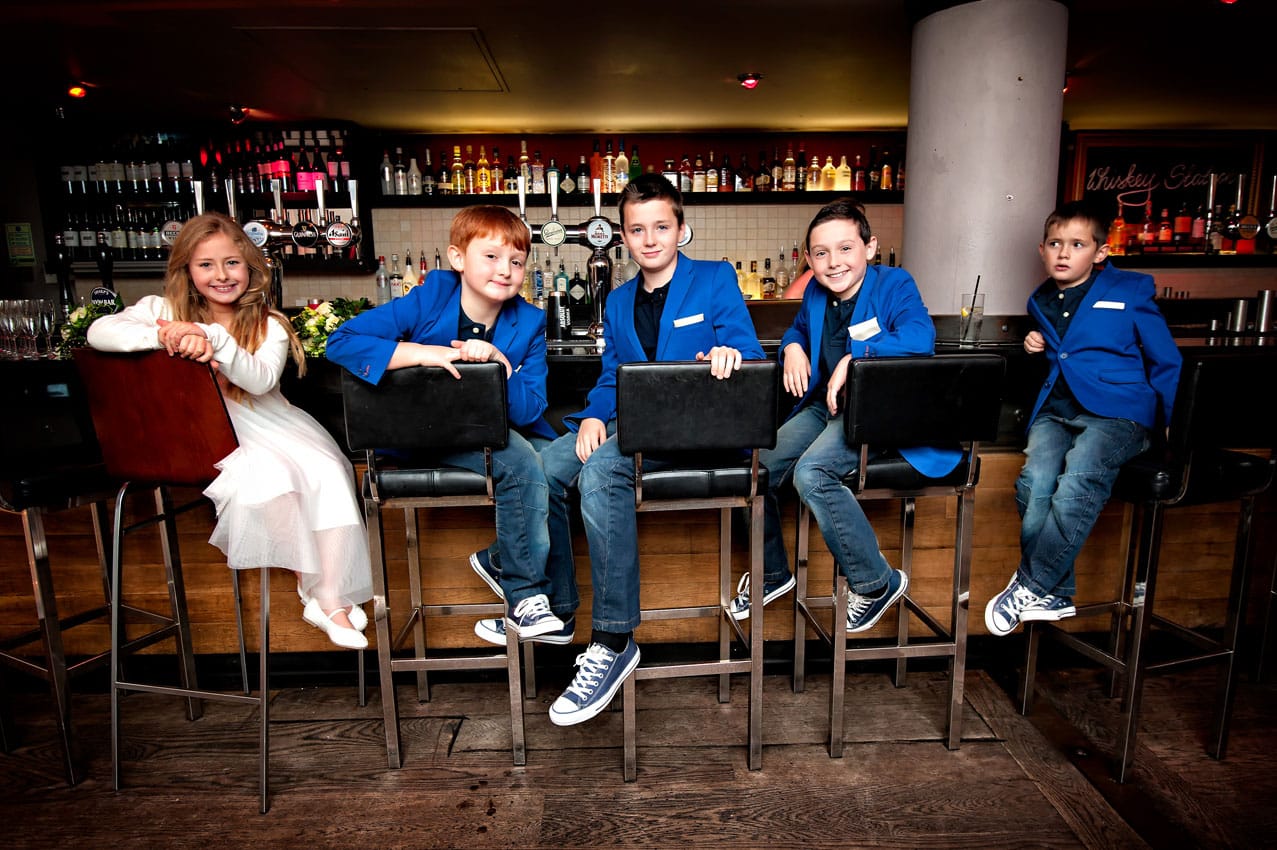 Boys in Suits with Girl on Bar Stools at in Caerphilly - Birthday Party Photographer
