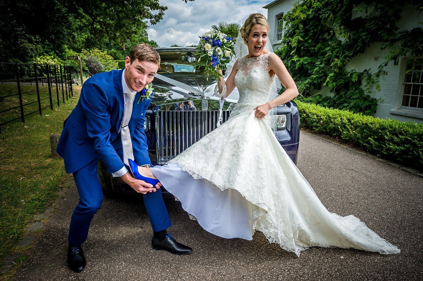 Groom Holding Bride's Foot at Wedding - Caerphilly Wedding Photographer