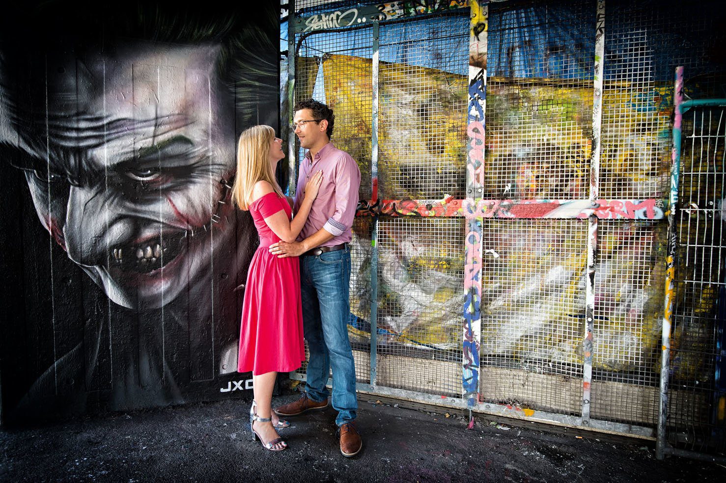 Loving Couple with Graffiti of The Joker