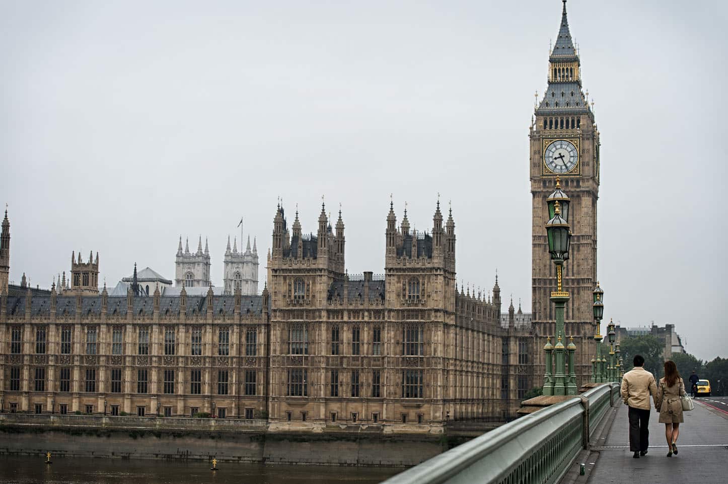 Couple Walking Across Westminster Bridge - London Engagement Photography