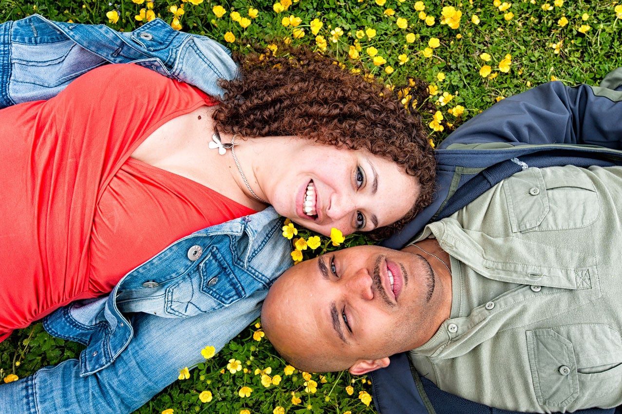 Couple Lying on Grass on - Engagement Photography in Cardiff