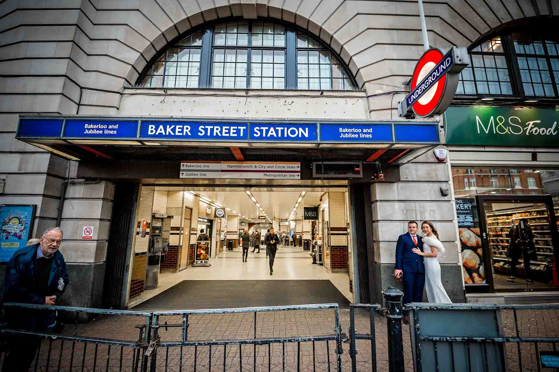 Wedding couple standing in front of Baker Street Station in London