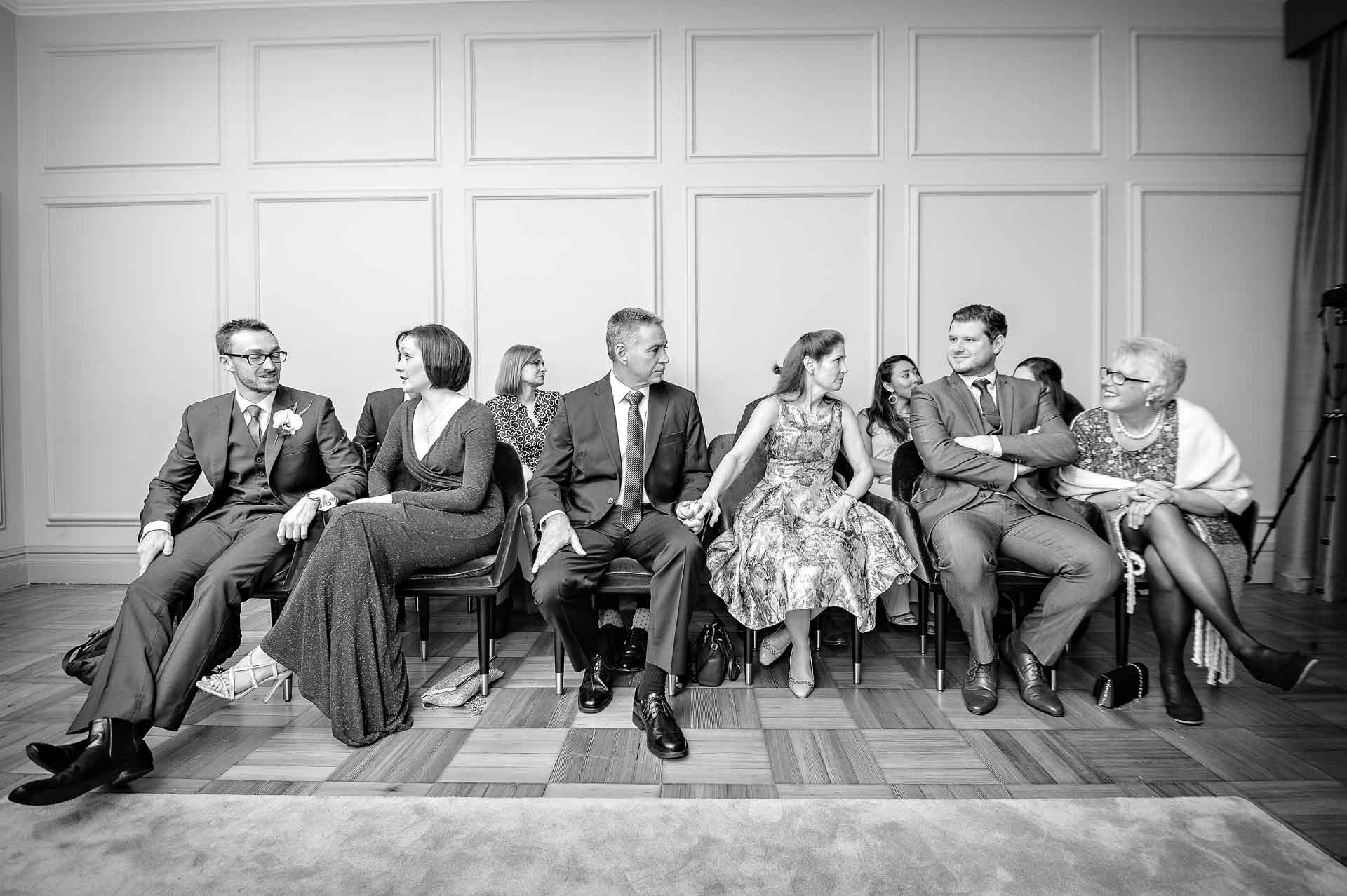 Wedding guests waiting in rows for the couple to arrive at Old Marylebone Town Hall wedding