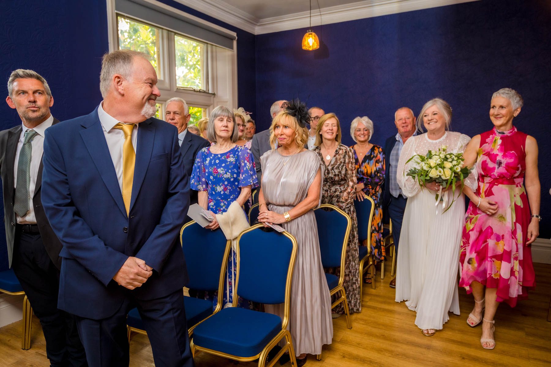 The bride walks down the aisle at Insole Court with her father