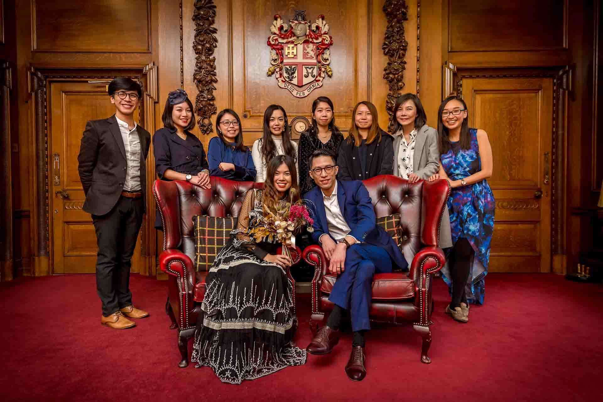 Group Portrait of wedding party in the Mayors Parlour of Islington Town Hall