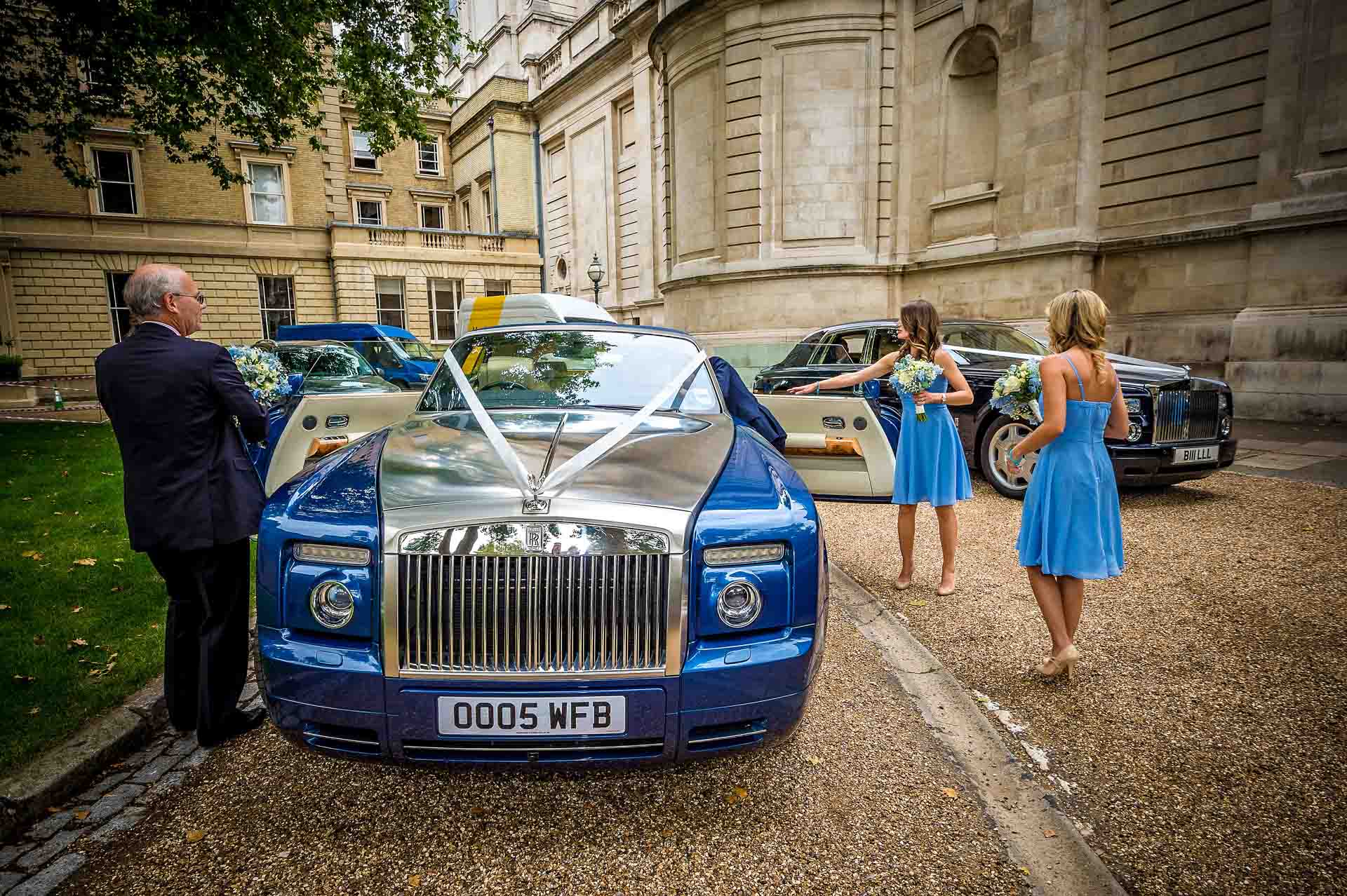 Blue Wedding Rolls Royce with Bridesmaids in blue dresses