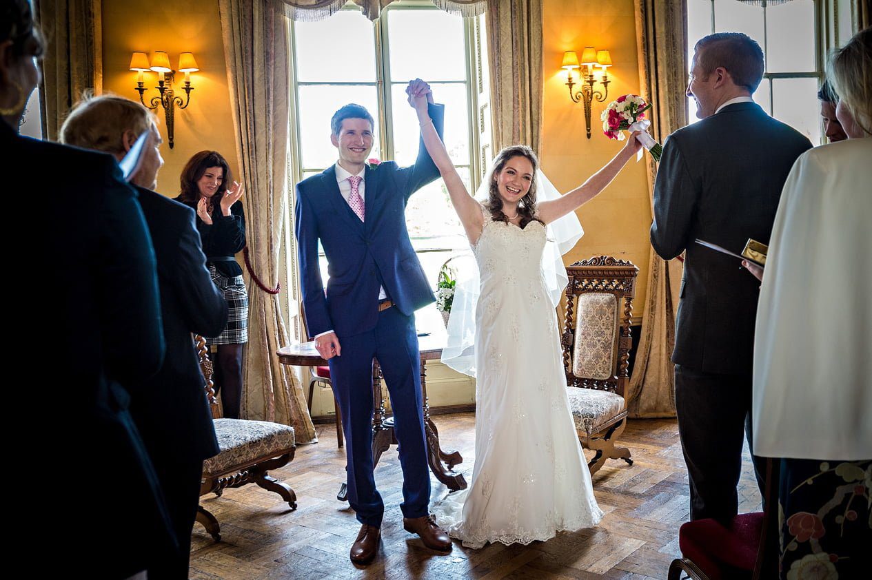 Couple excited as they have been pronounced husband and wife at Hampton Court House