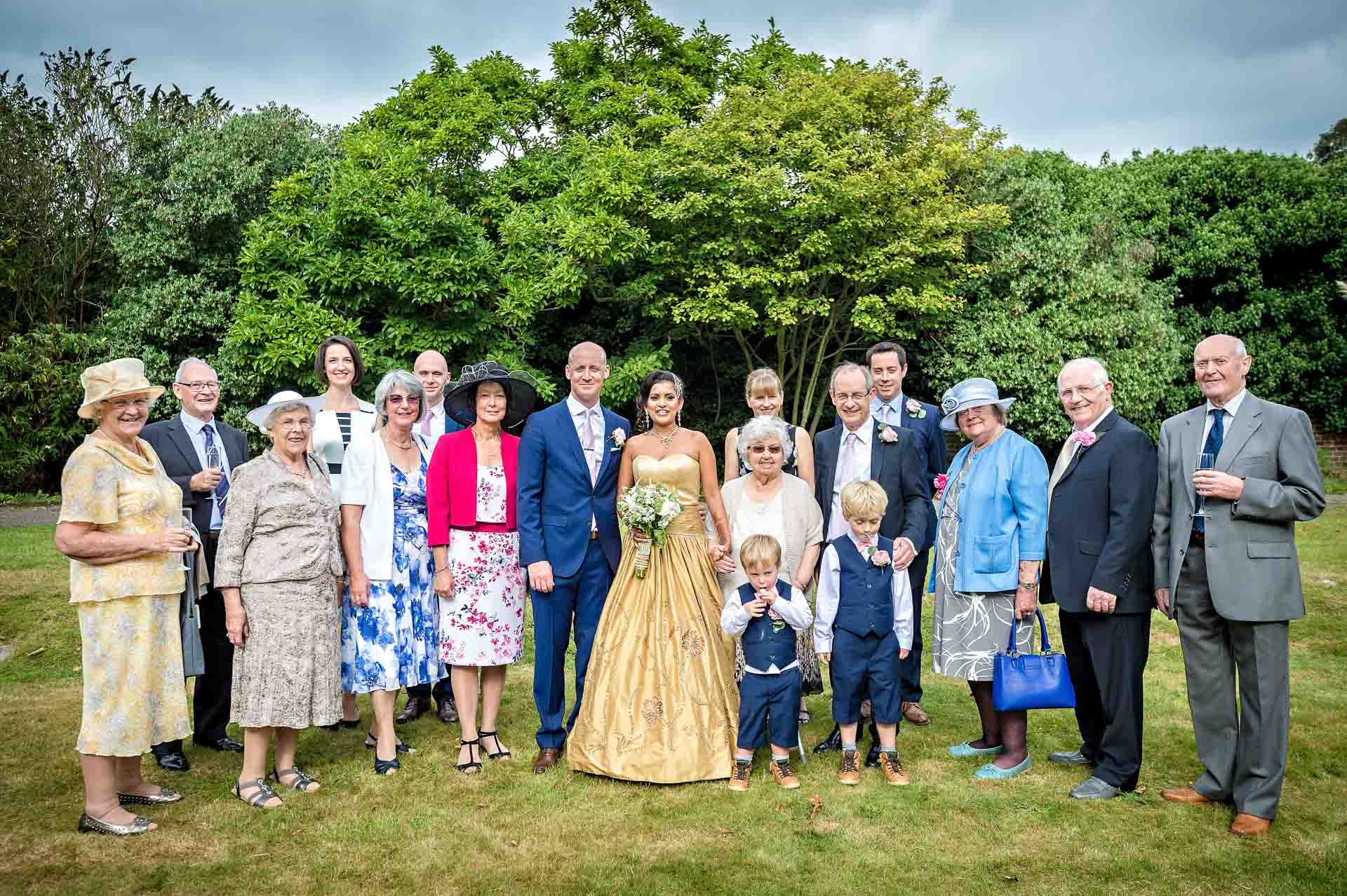 Large group shot of family at wedding in Hampton Court House