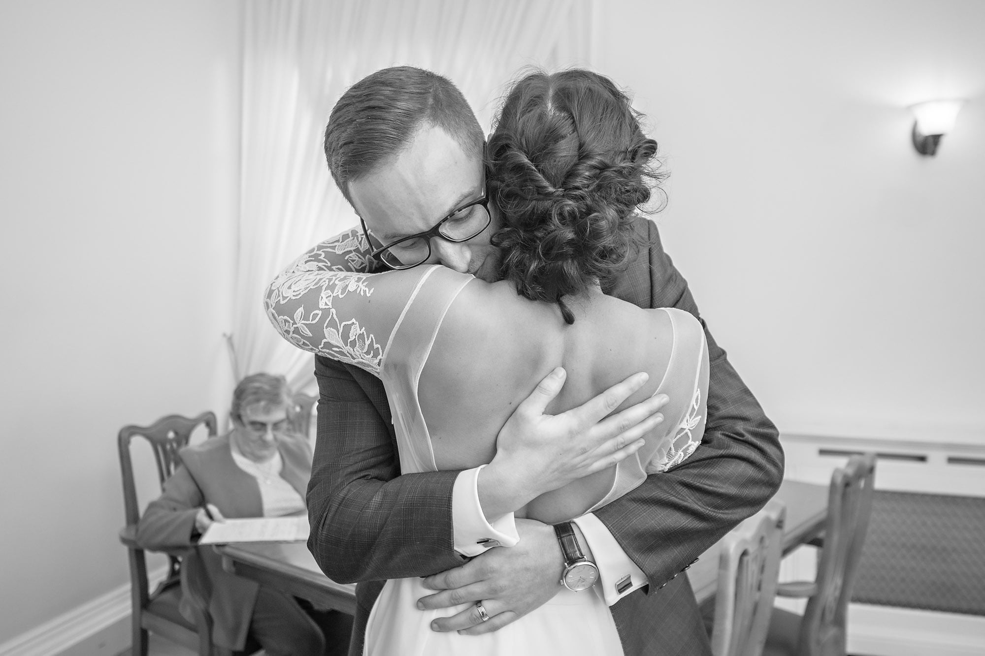 Passionate close-up hug following wedding vows in Woolwich
