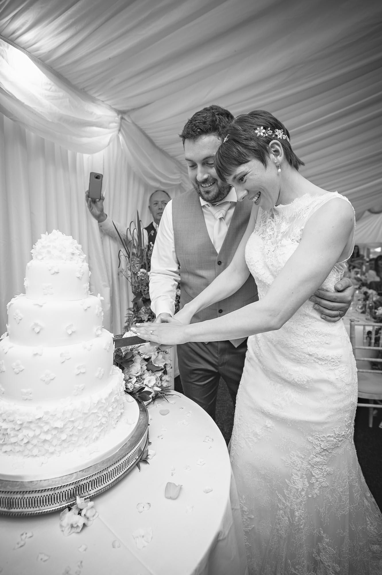 The newly-weds cut the cake at their New House Country Hotel wedding