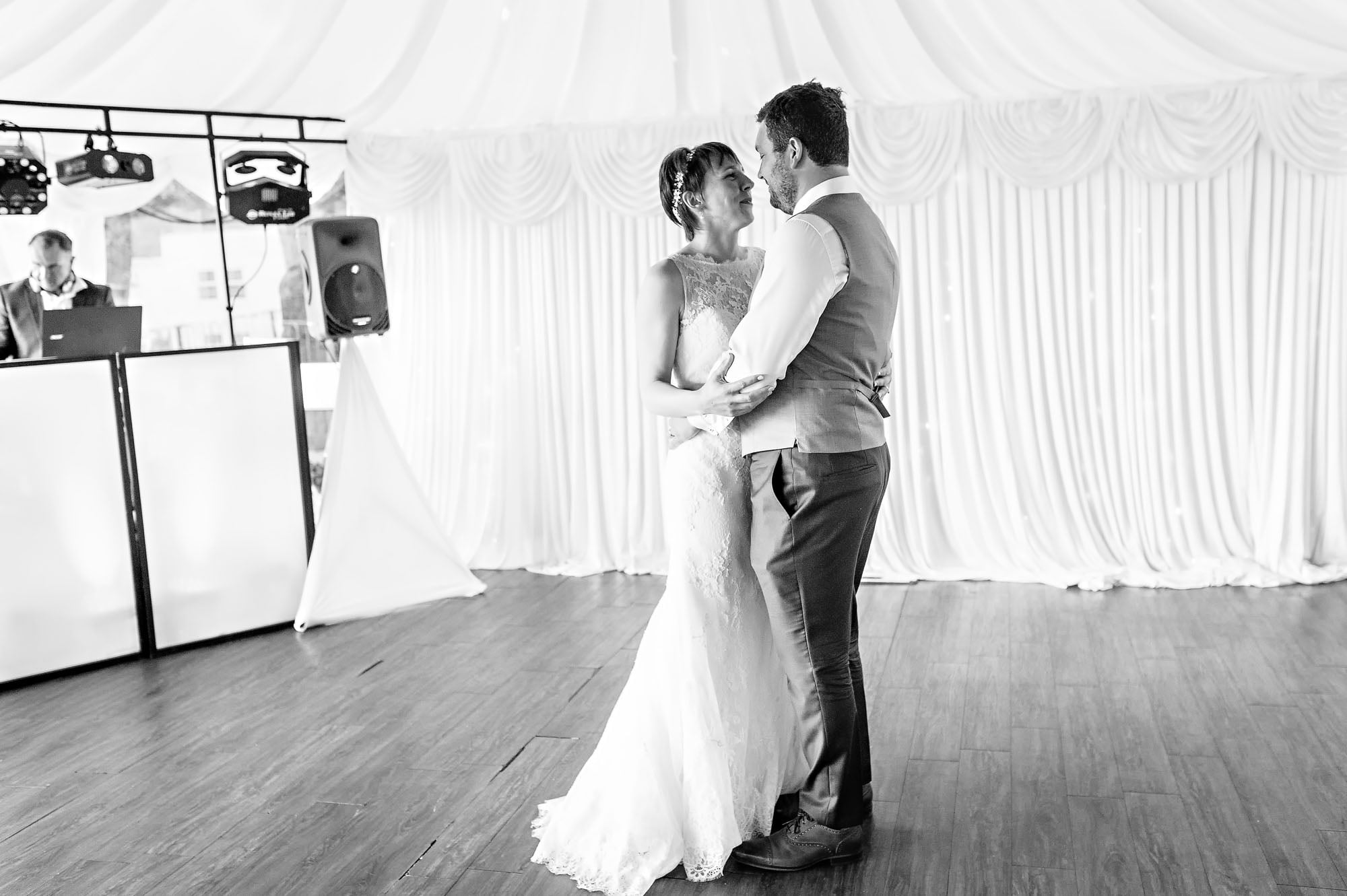 The bride and groom take their first dance in the Marquee at New House Country Hotel
