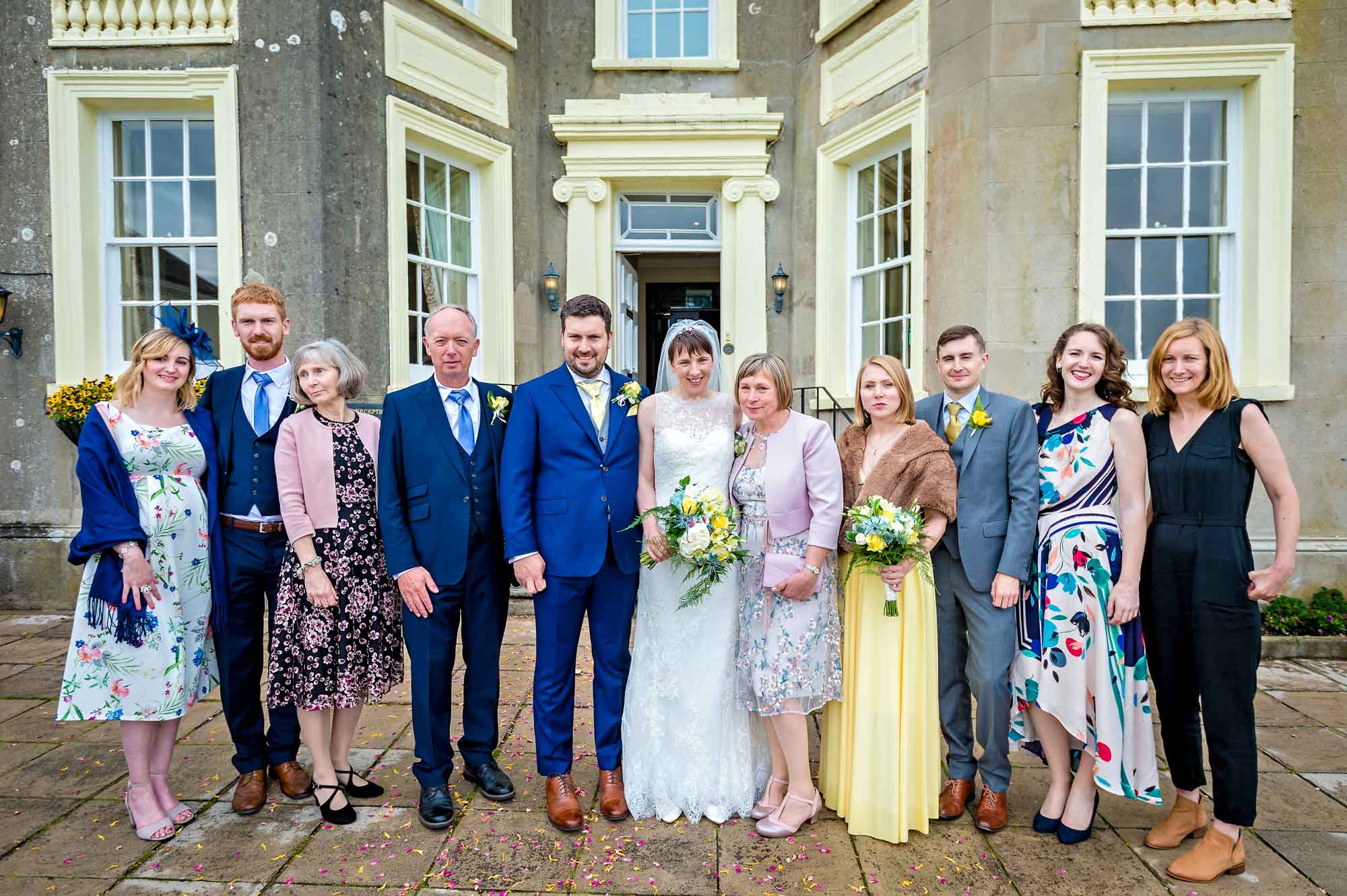 Wedding portrait of family outside New House Country Hotel near Caerphilly