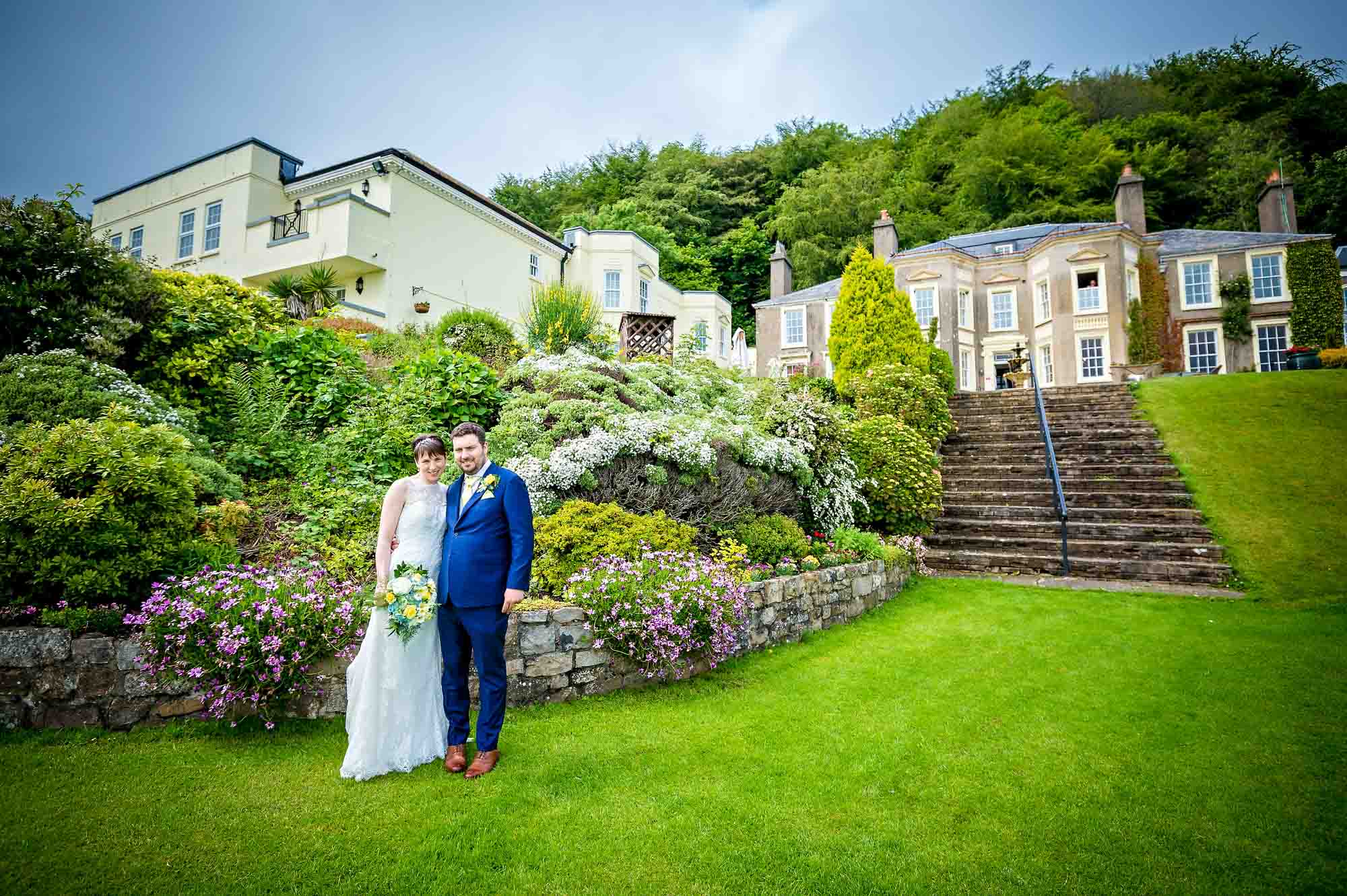 Portrait of the couple in gardens of New House Country Hotel