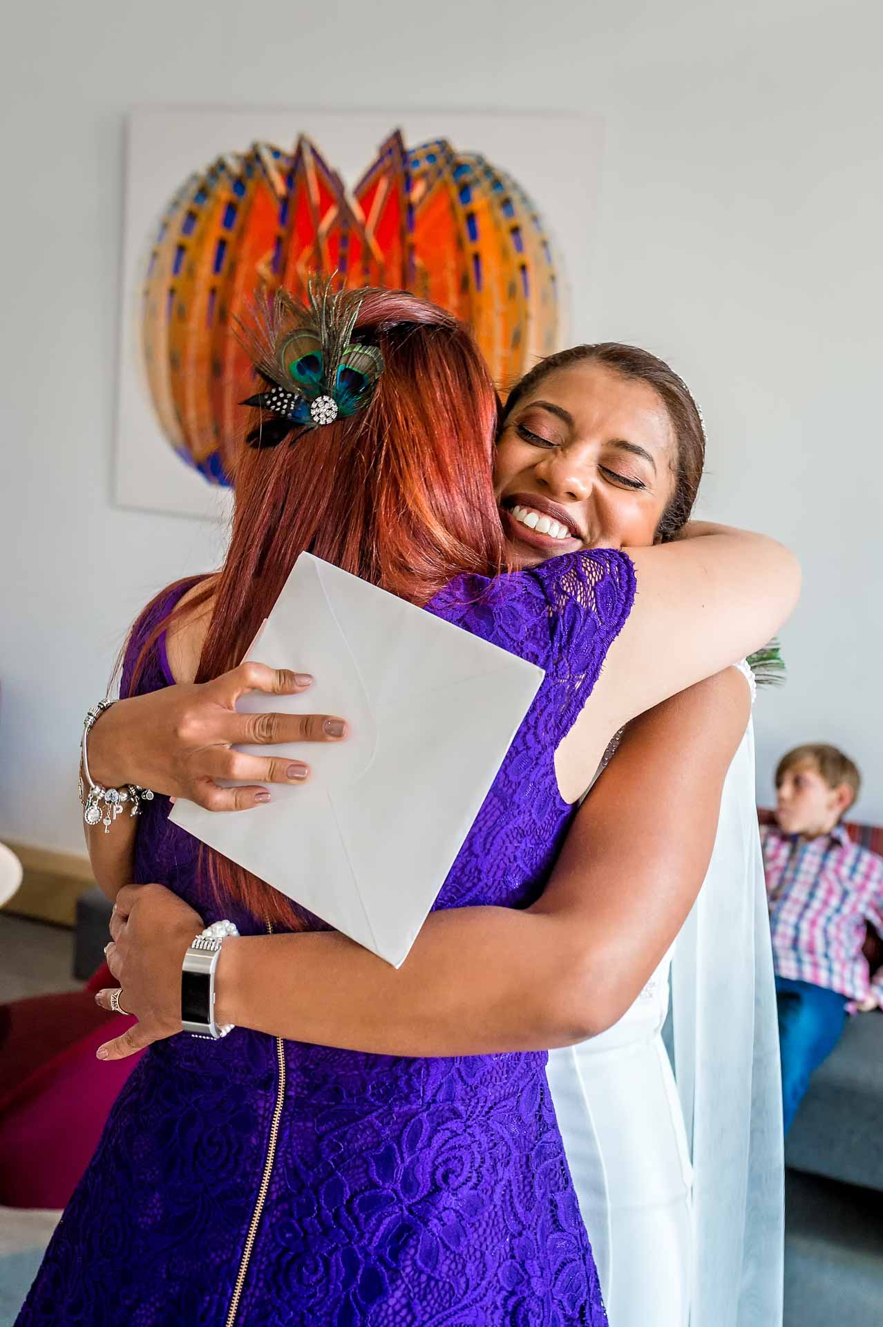 Bride Hugging Female Guest After Marriage Ceremony