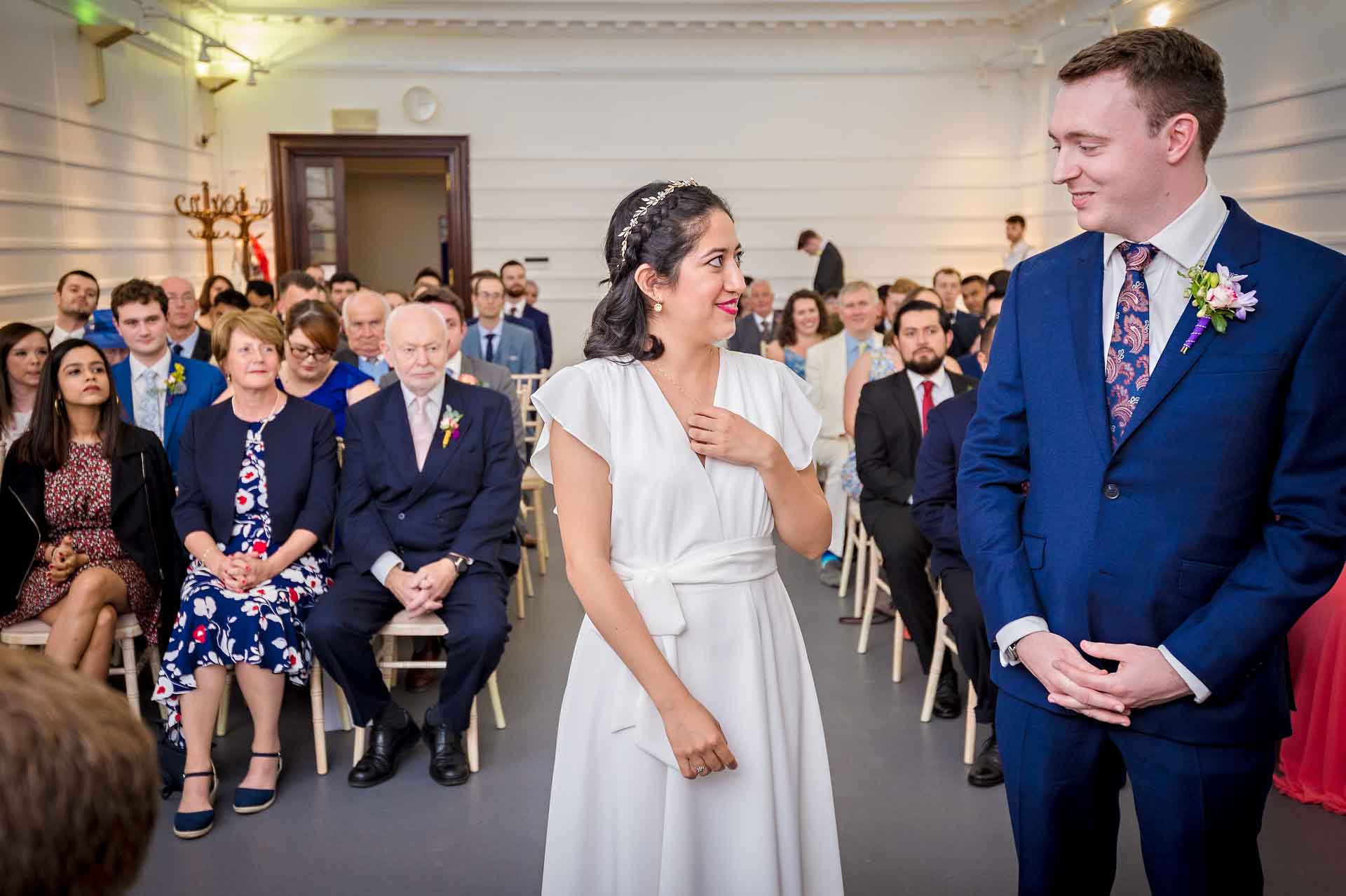 Bride and Groom looking at each other at Fulham Library wedding