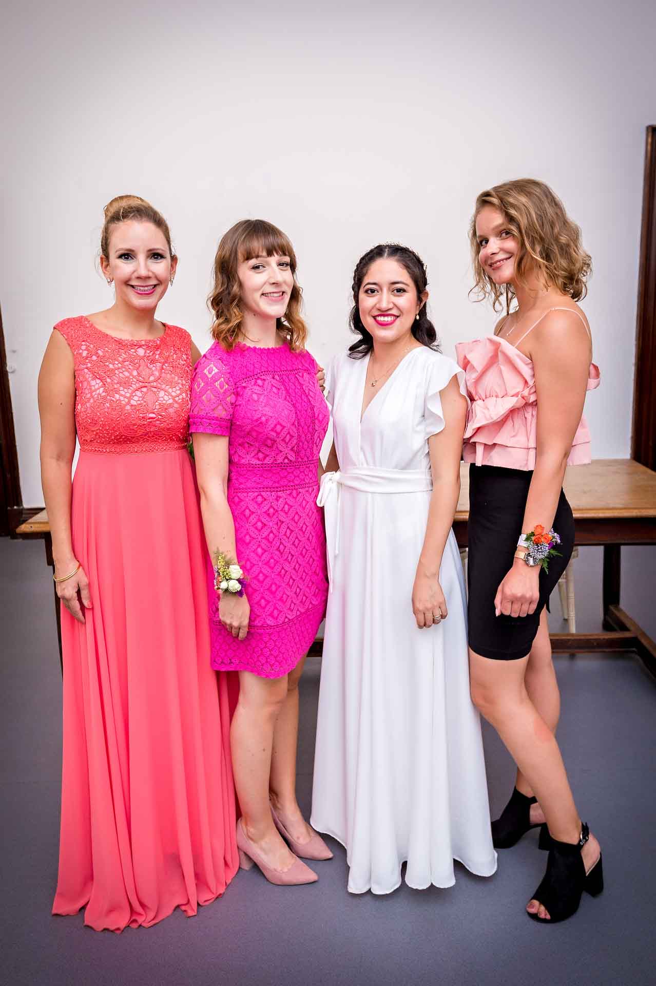 Bride and bridesmaids posing for wedding portrait