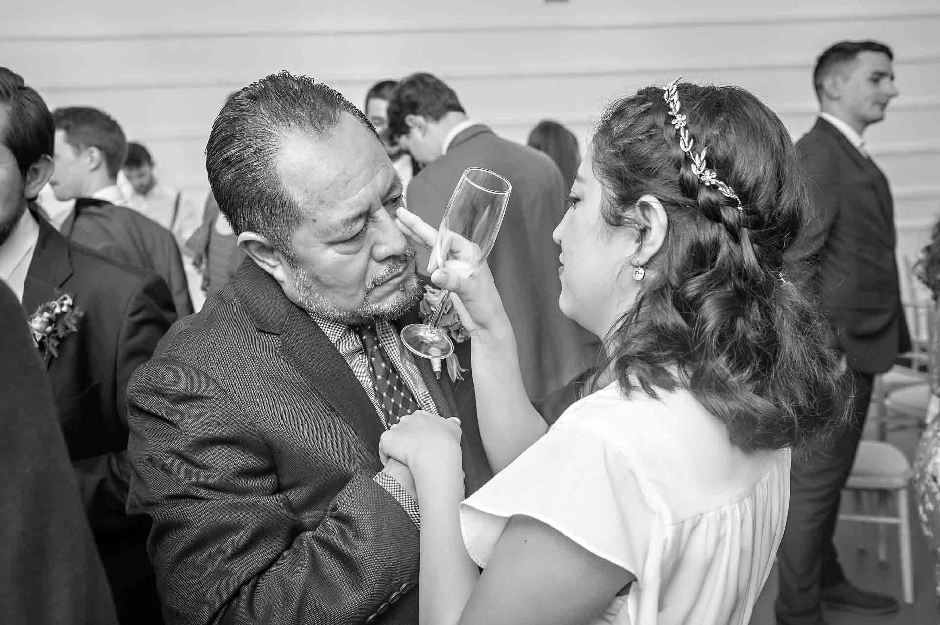 Bride wipes away father's tear at wedding in Fulham