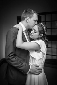 Wedding Portrait of Groom holding Bride in black and white