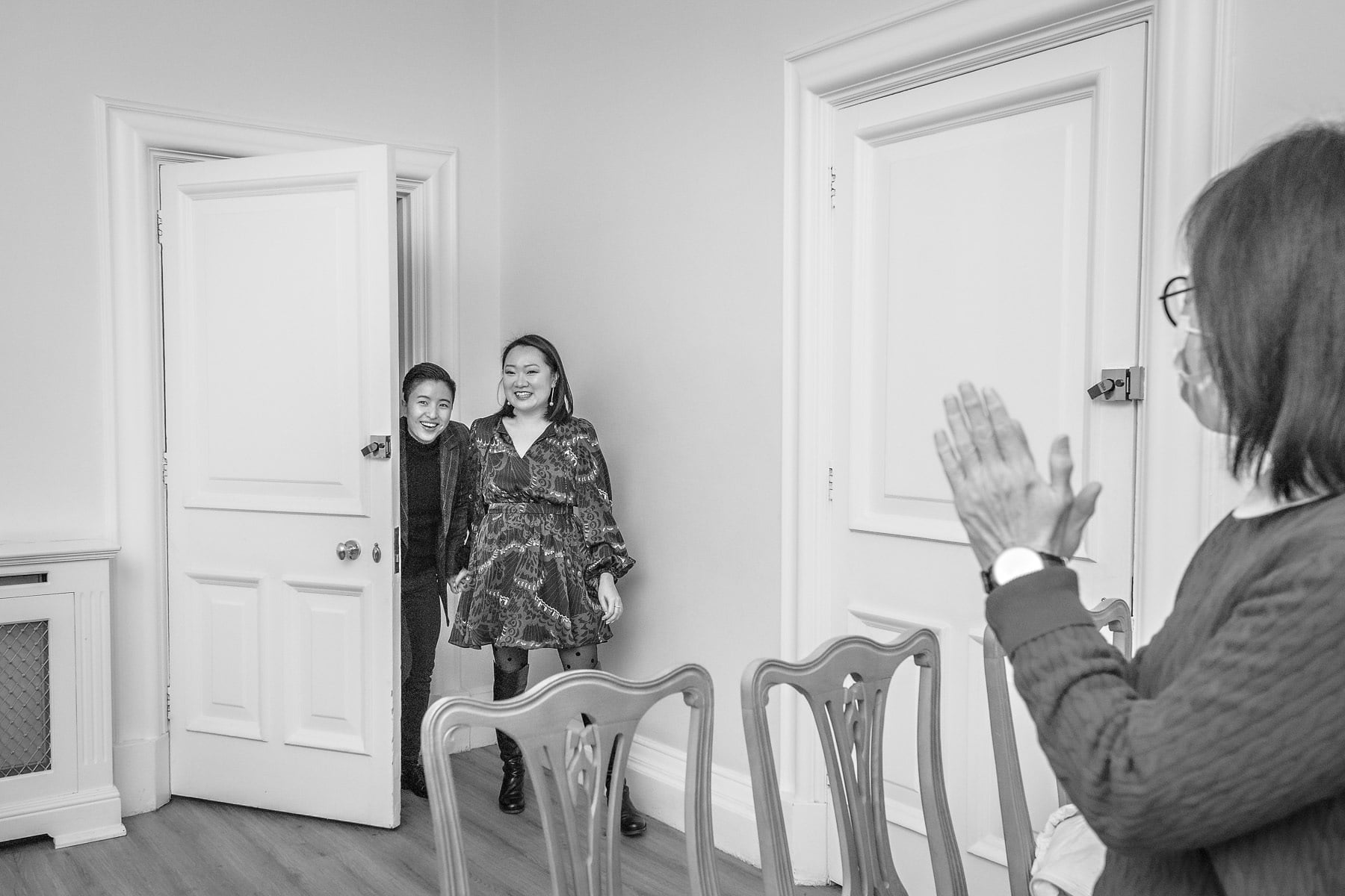 Fun brides enter their LGBTQ+ wedding at Greenwich Town Hall