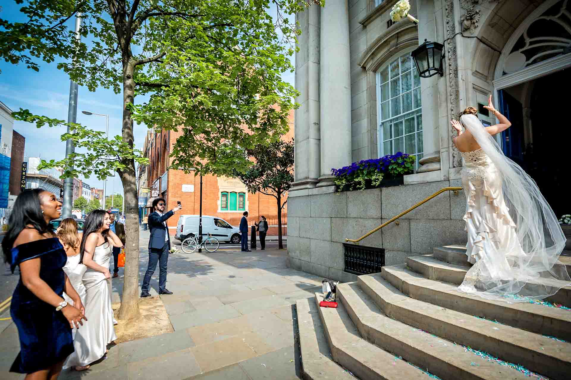 Bride Tossing Bouquet at London Registry Office