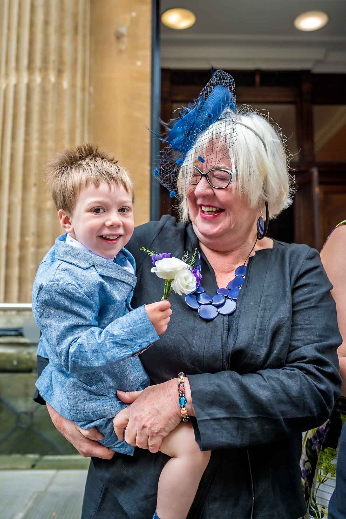 Happy grandma holds smiling grandson in Bristol