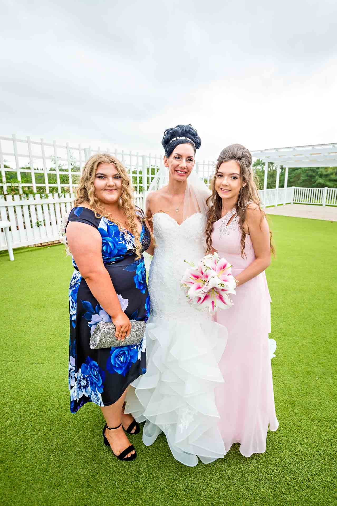 Bride poses with two friends Outside Marquee at Ridgeway Golf Club