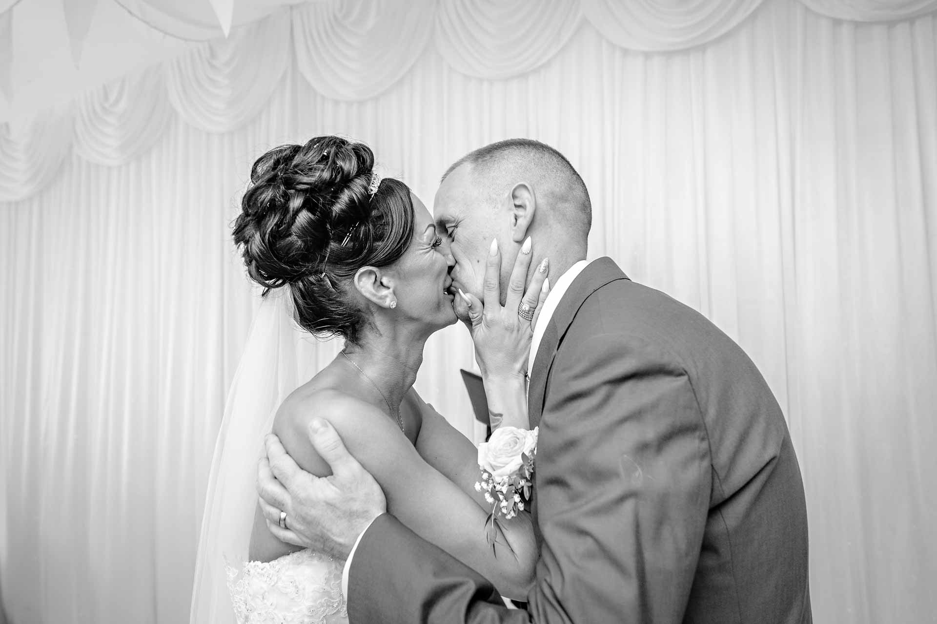 Newly-weds kiss at their wedding in Caerphilly, South Wales