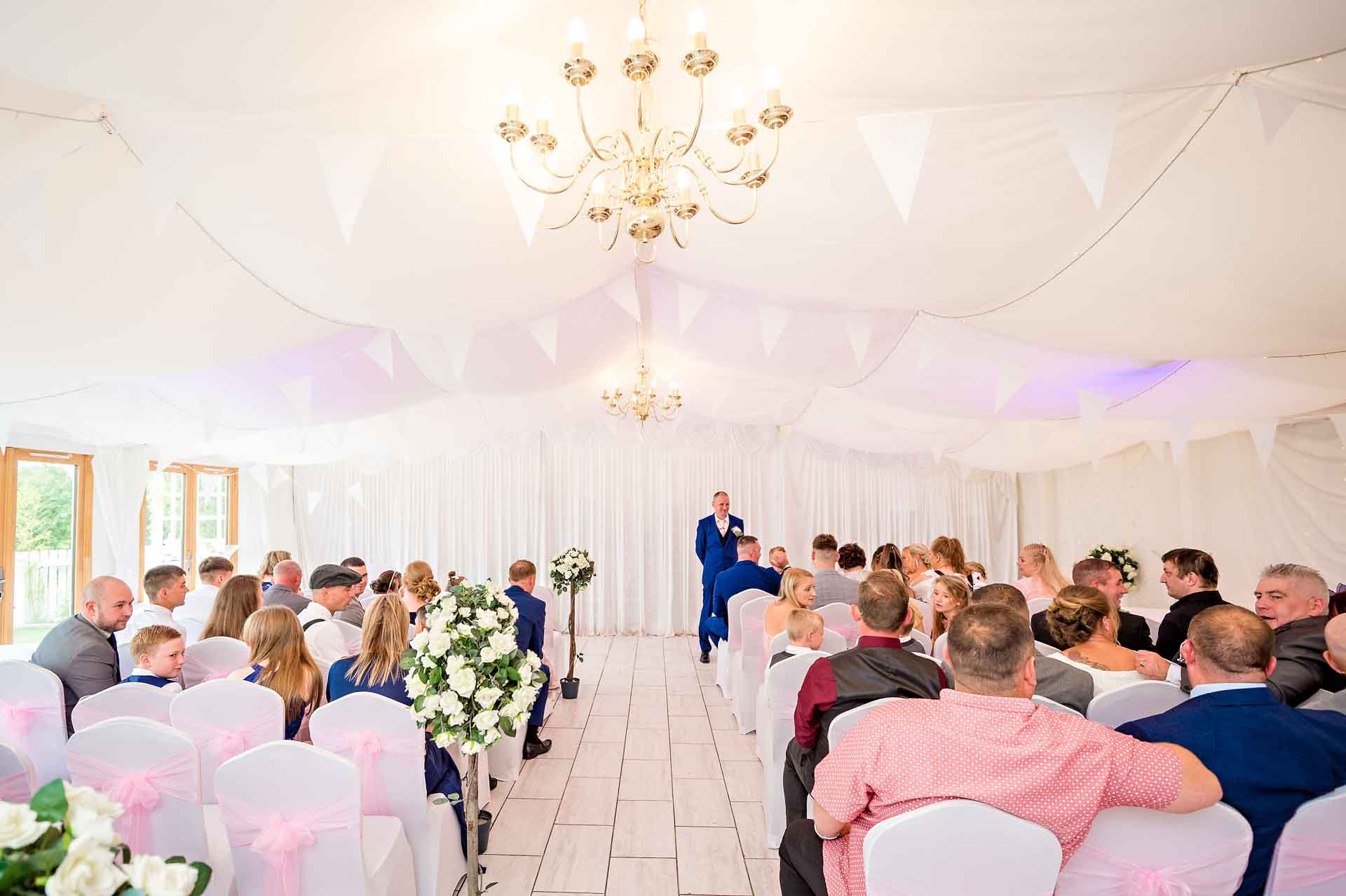 The Marquee at Ridgeway Golf Club with groom waiting at the front for his bride