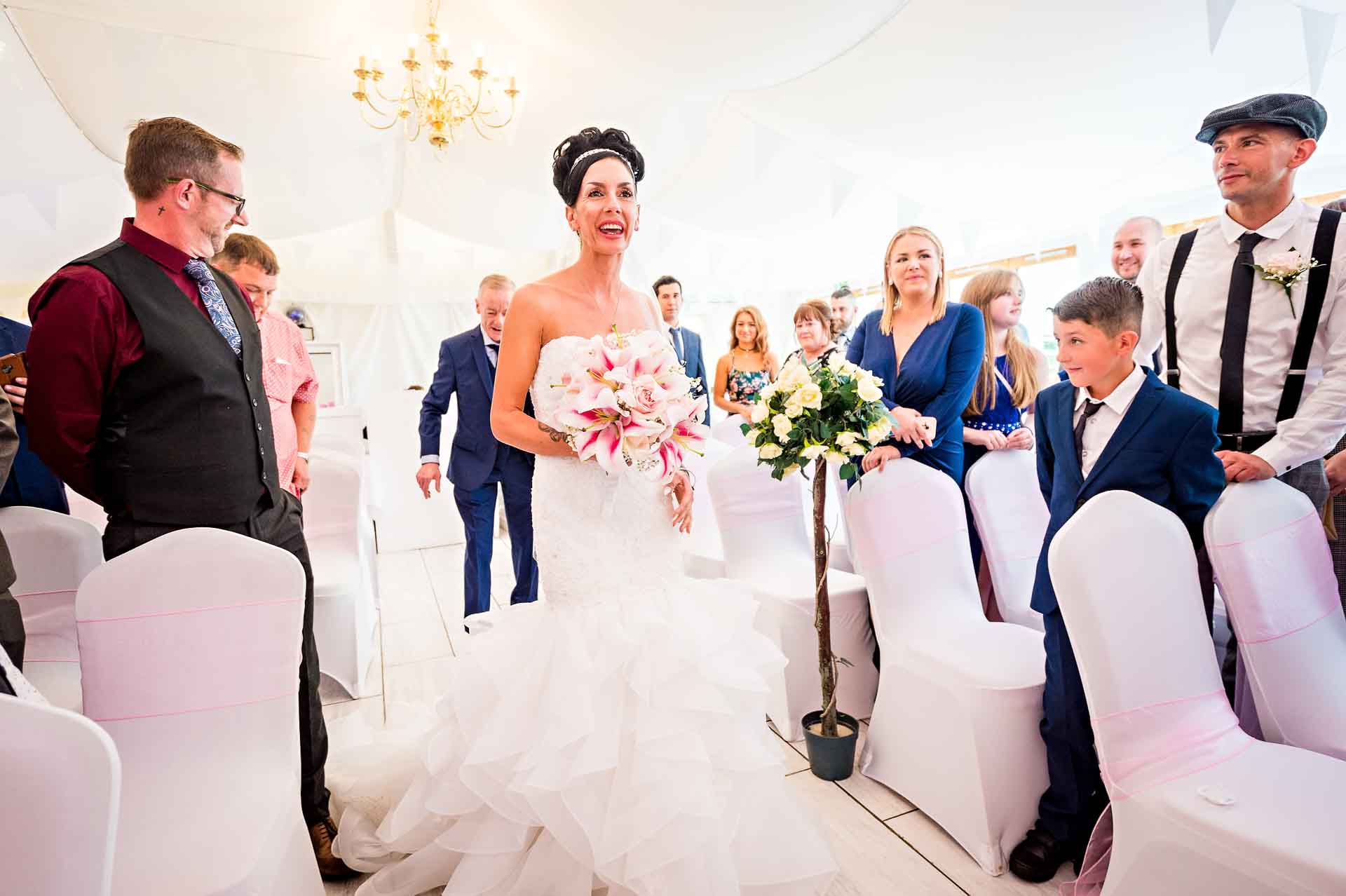 The bride walking down the aisle at Marquee at Ridgeway Golf Club