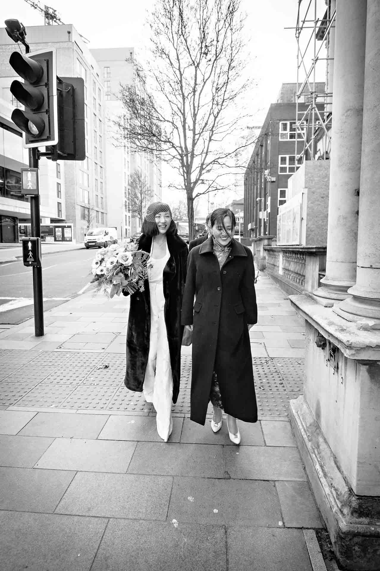 The bride and her mum approach Woolwich Town Hall on Wellington Street