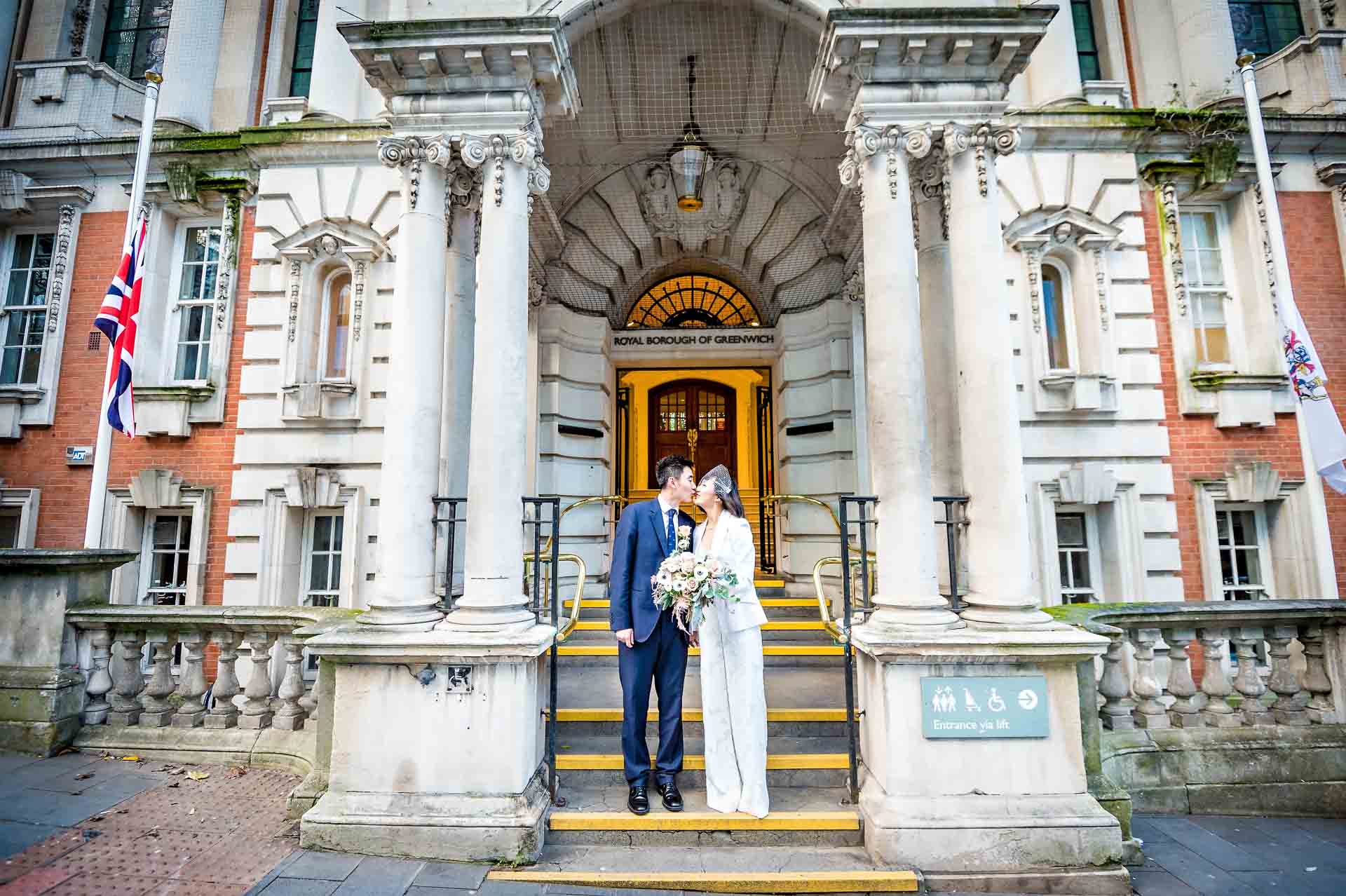 The couple kiss outside at their Woolwich Town Hall marriage