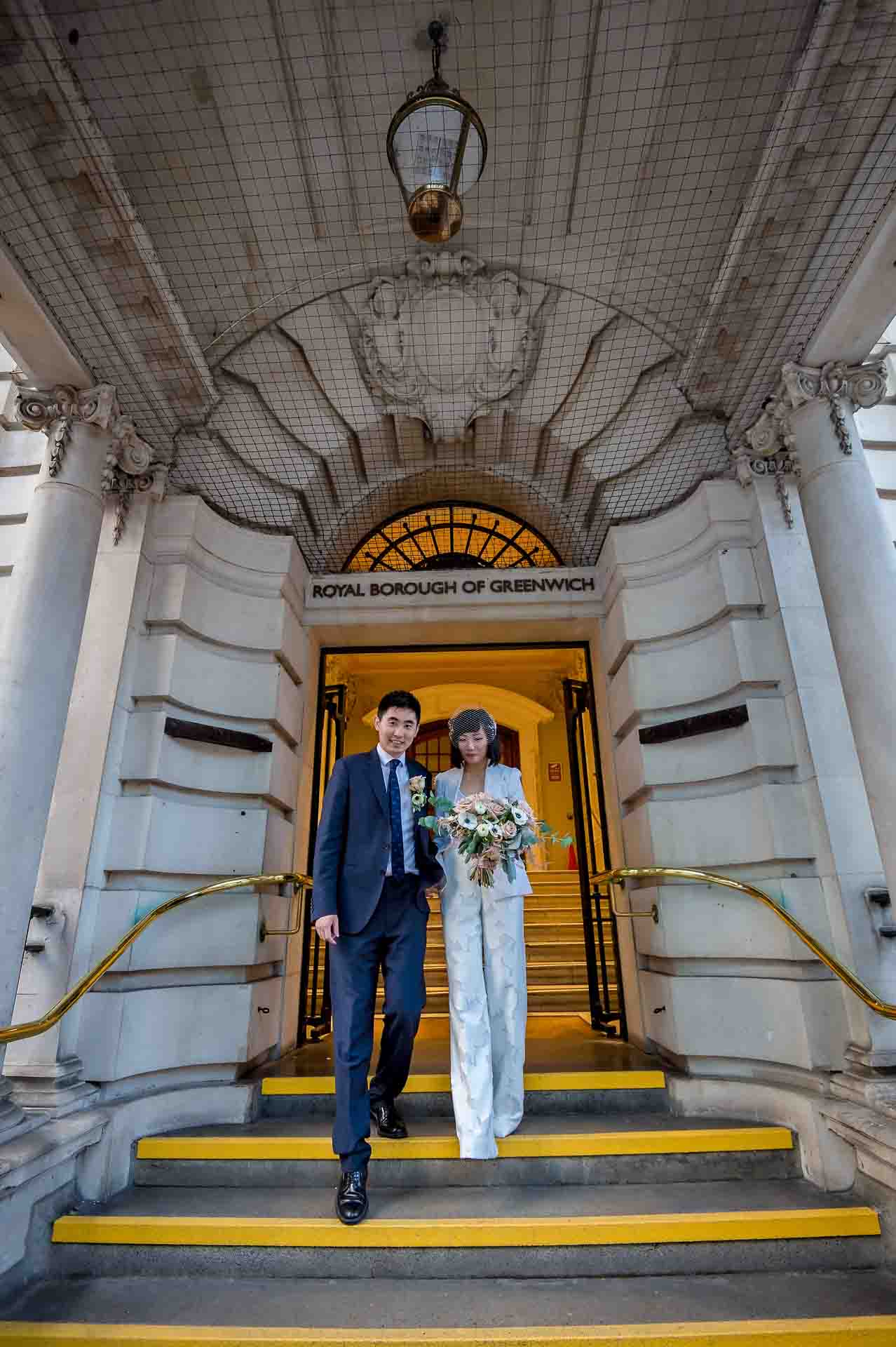 Couple leaving their Woolwich Town Hall wedding