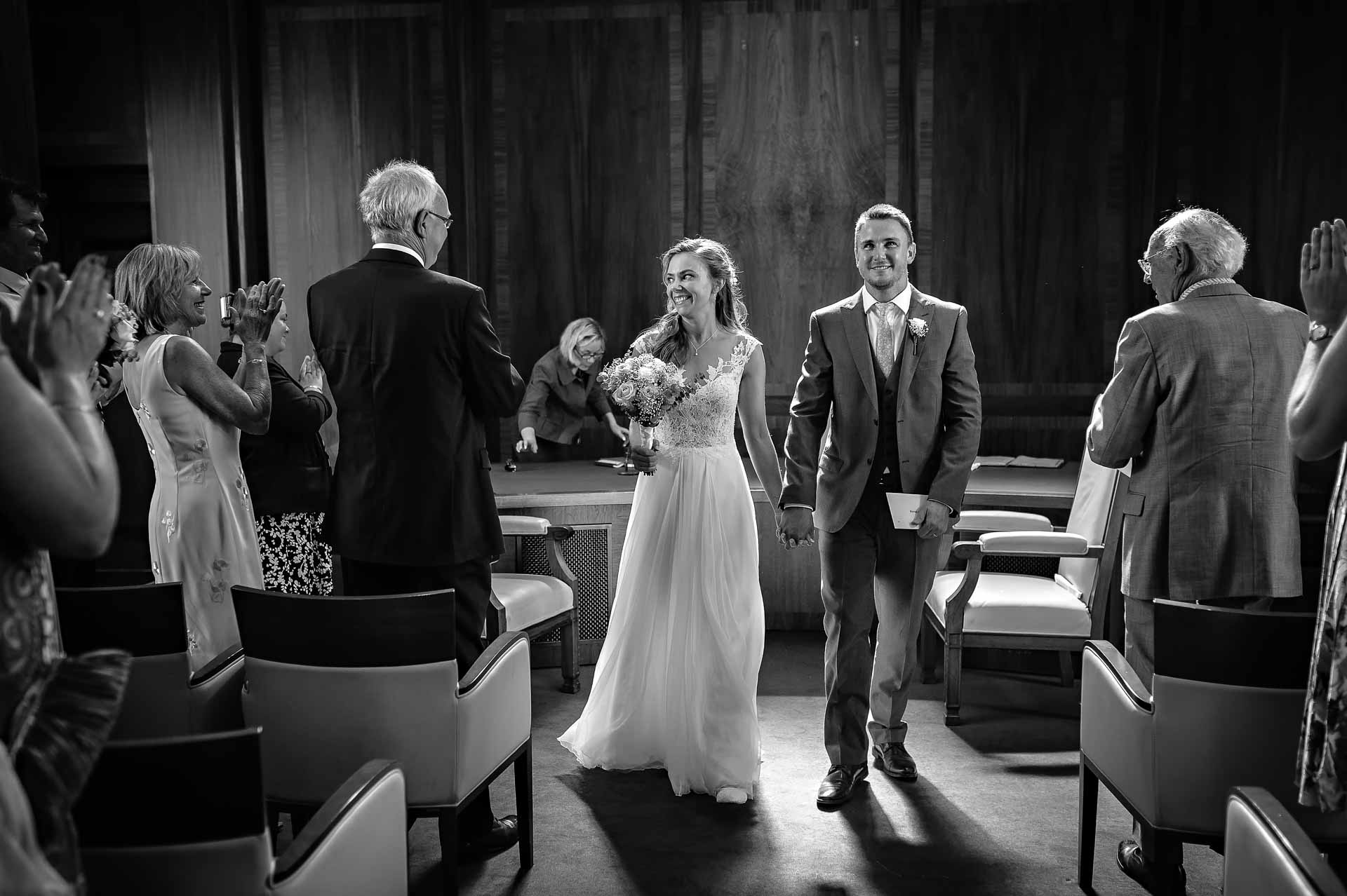 Couple Walking Back Down the Aisle at Stoke Newington Town Hall