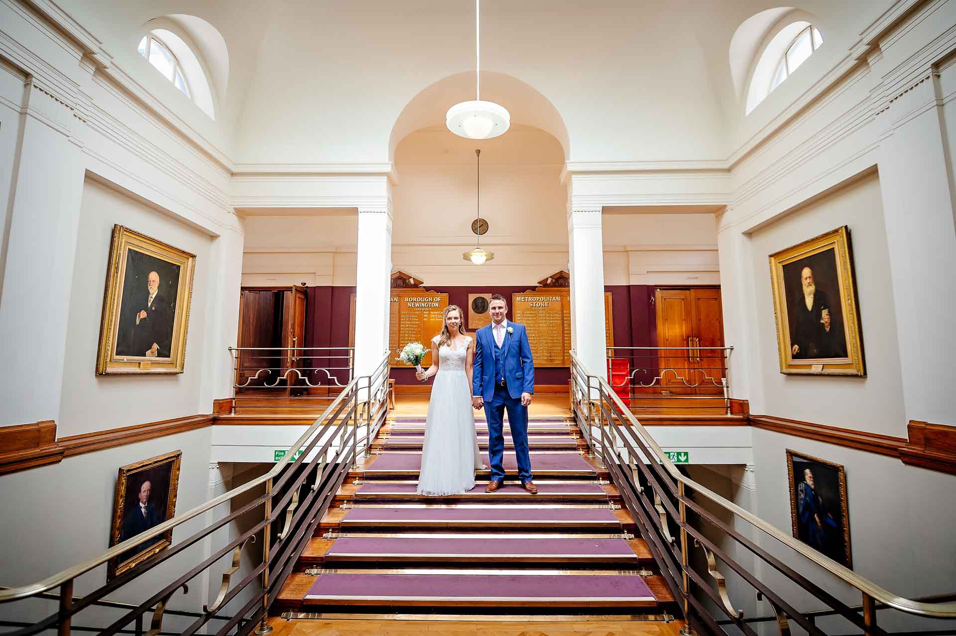 Posed Wedding Couple on Ornate Staircase