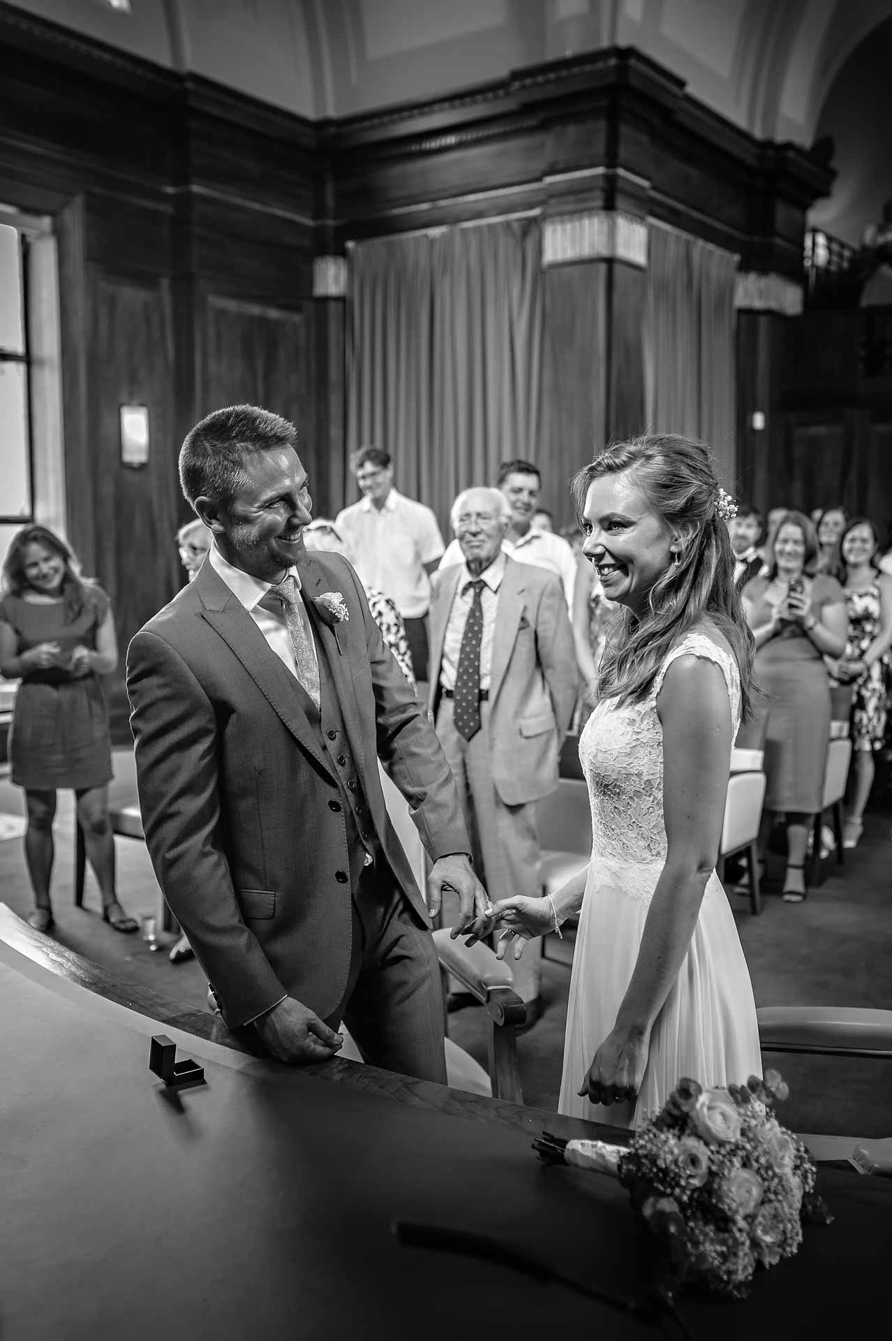 Bride and Groom Smiling after Exchange of Rings