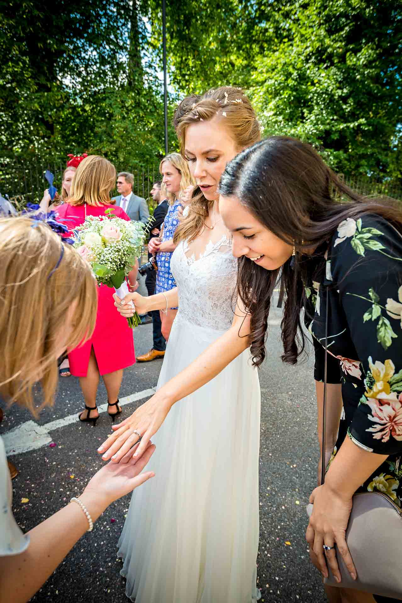 Wedding Guests Admiring Bride's Ring