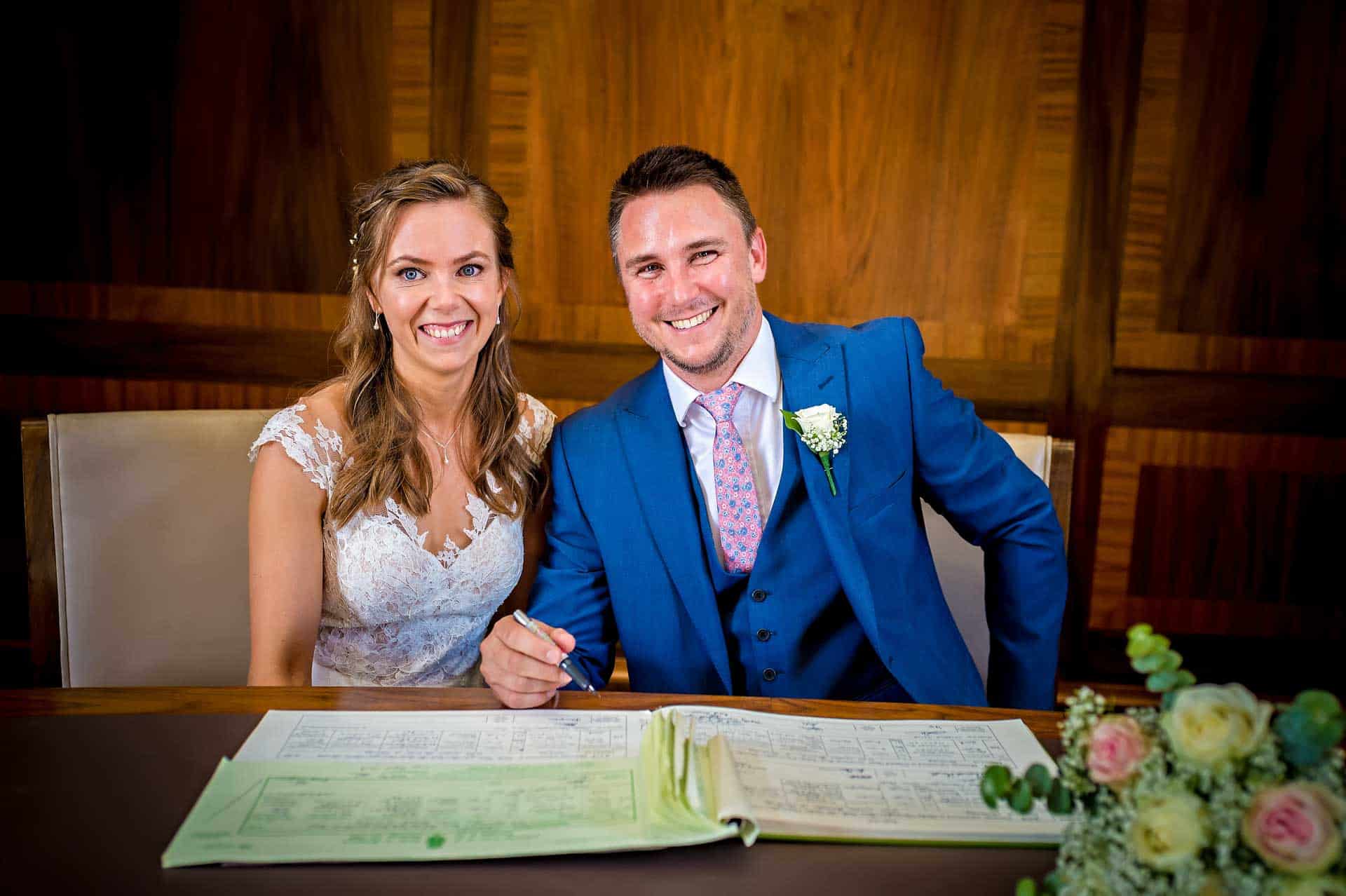 Posed Photo of Signing of the Register at Wedding